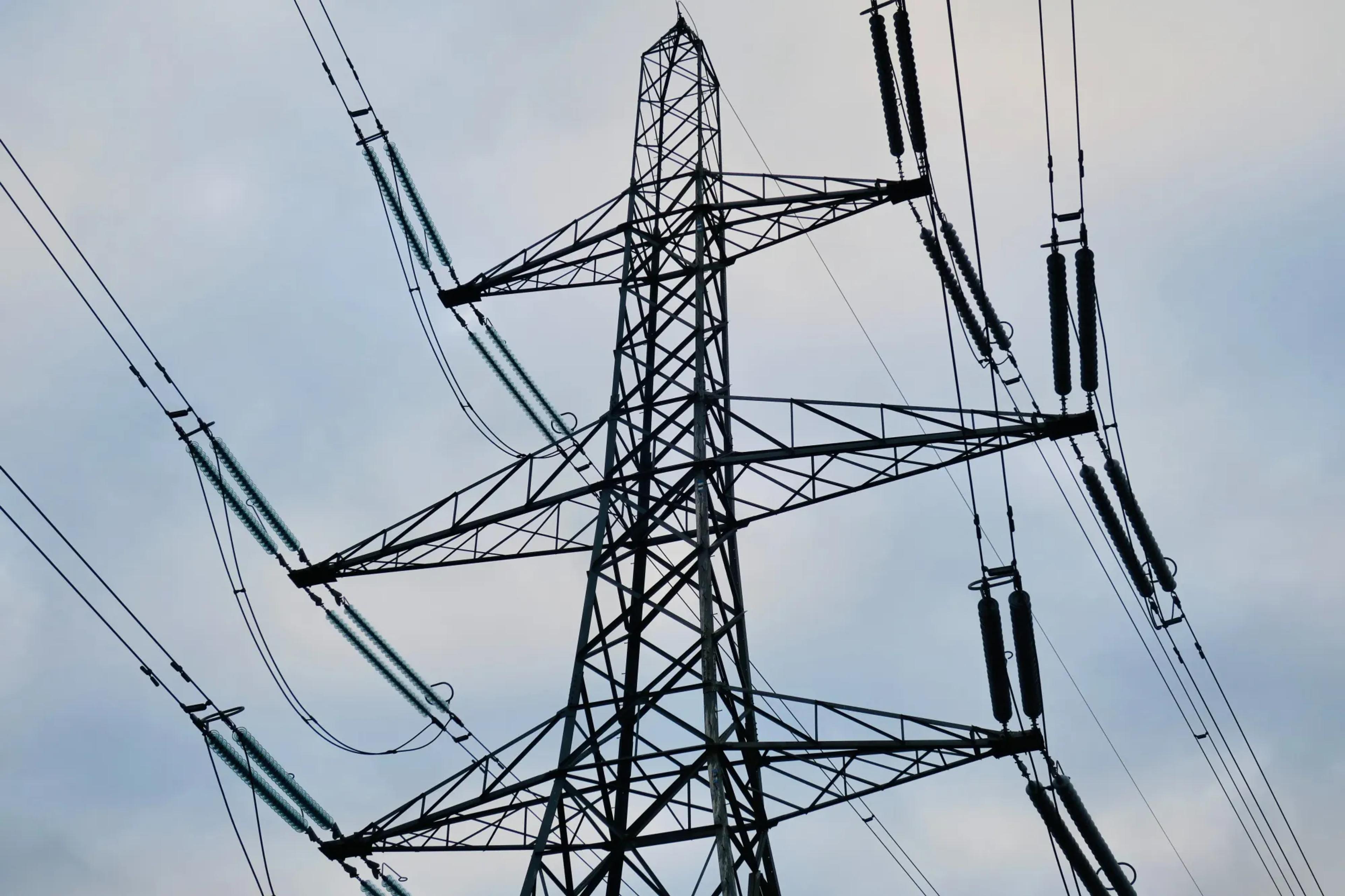 Electrical pylon against a cloudy sky