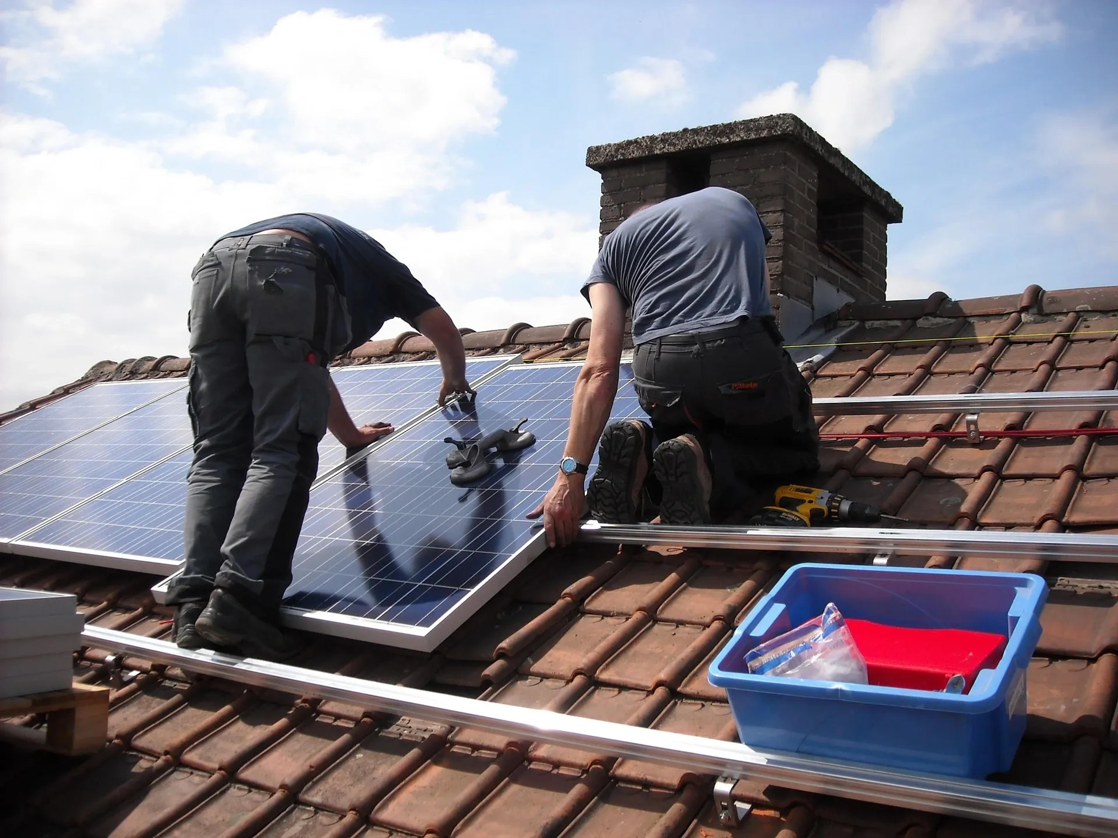 Solar panels being installed on a roof in the UK
