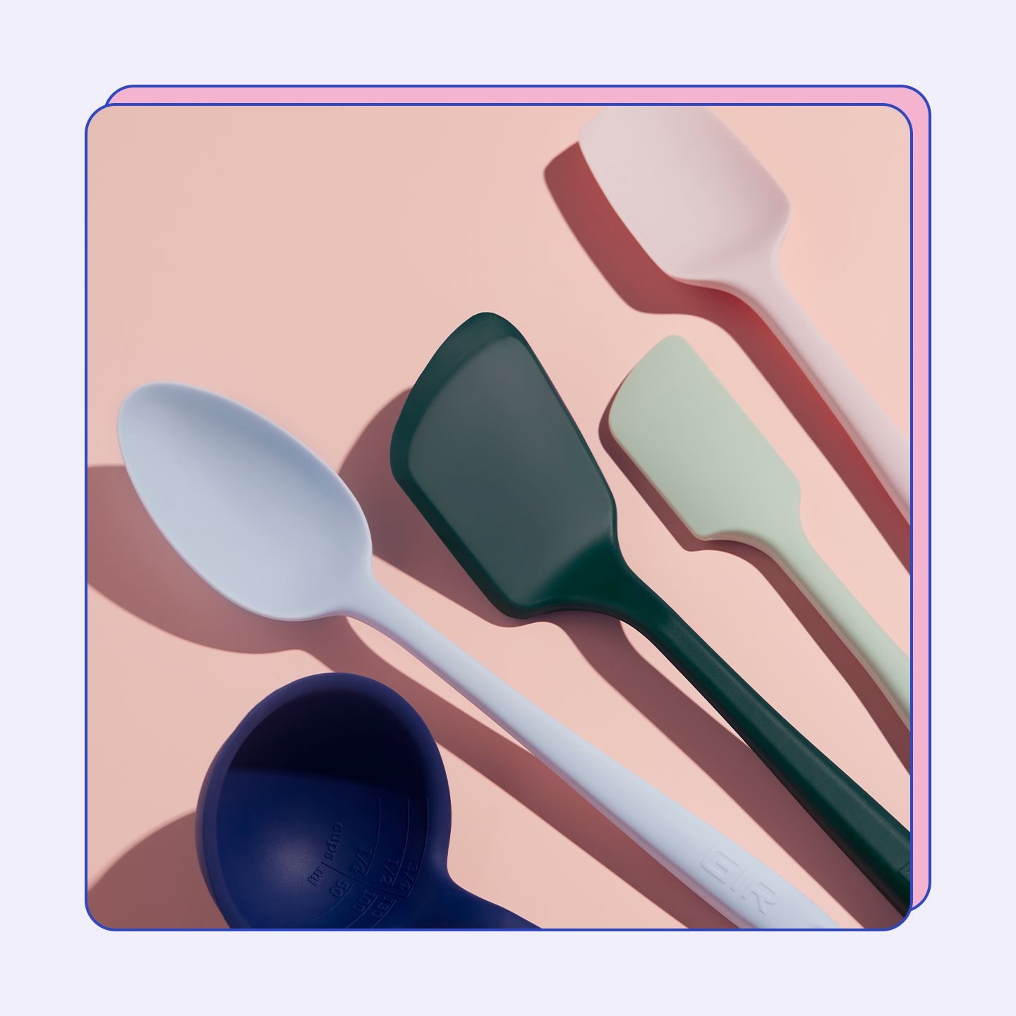 A mixed color 5-piece tool set on a pink background.
