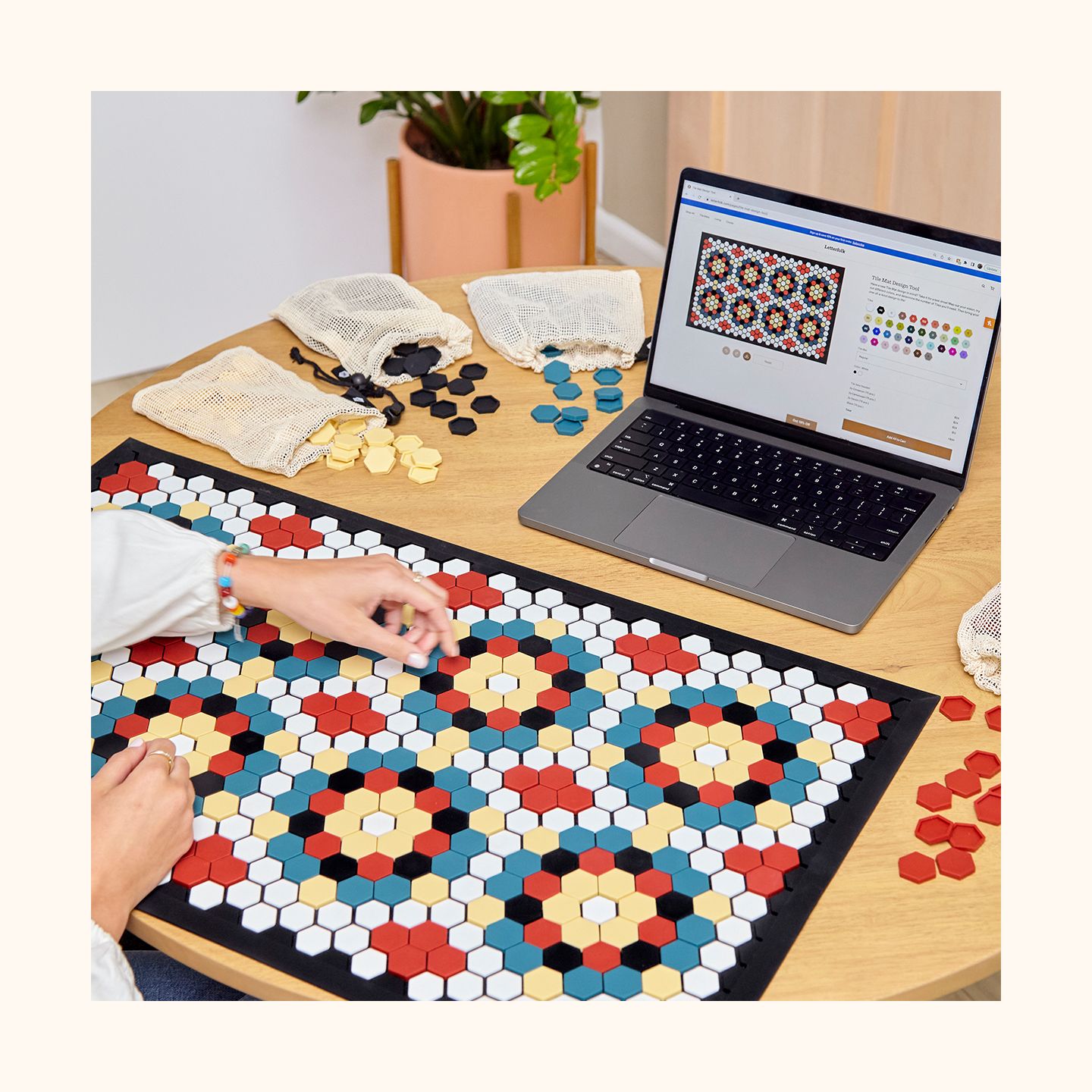 A person designing a Tile Mat with Tile Sets