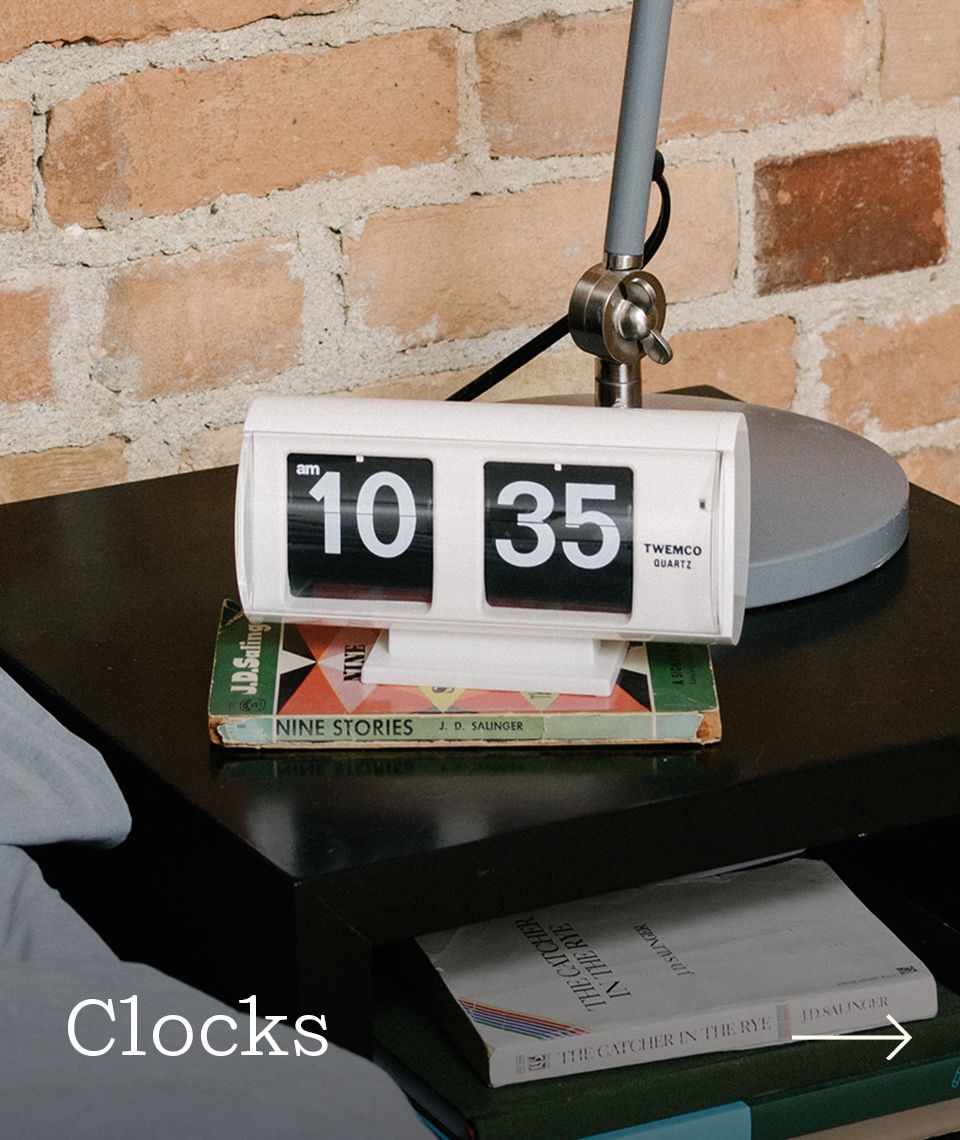 A bedside table shot of a clock.