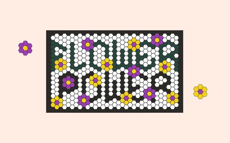 A tile mat that has a "flower power" design written on it.