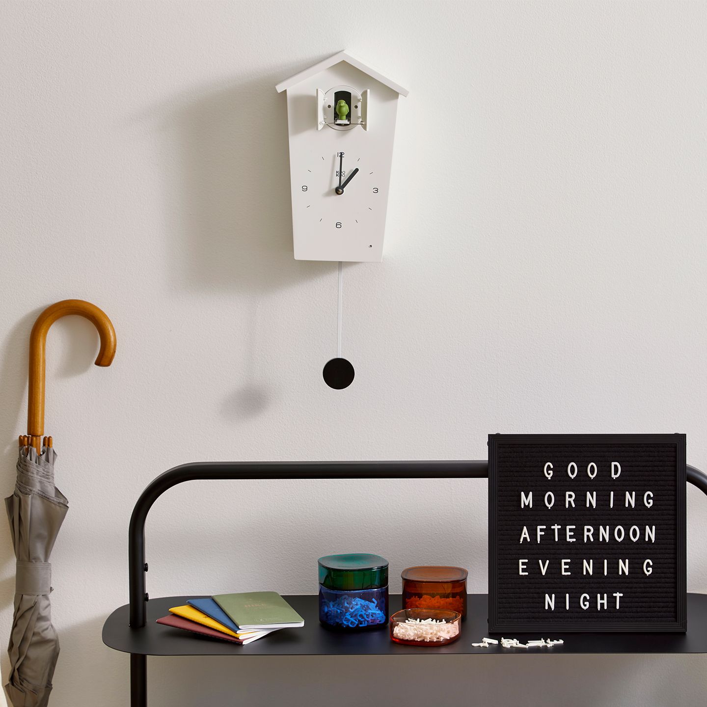 An array of items displayed on an entryway rack.