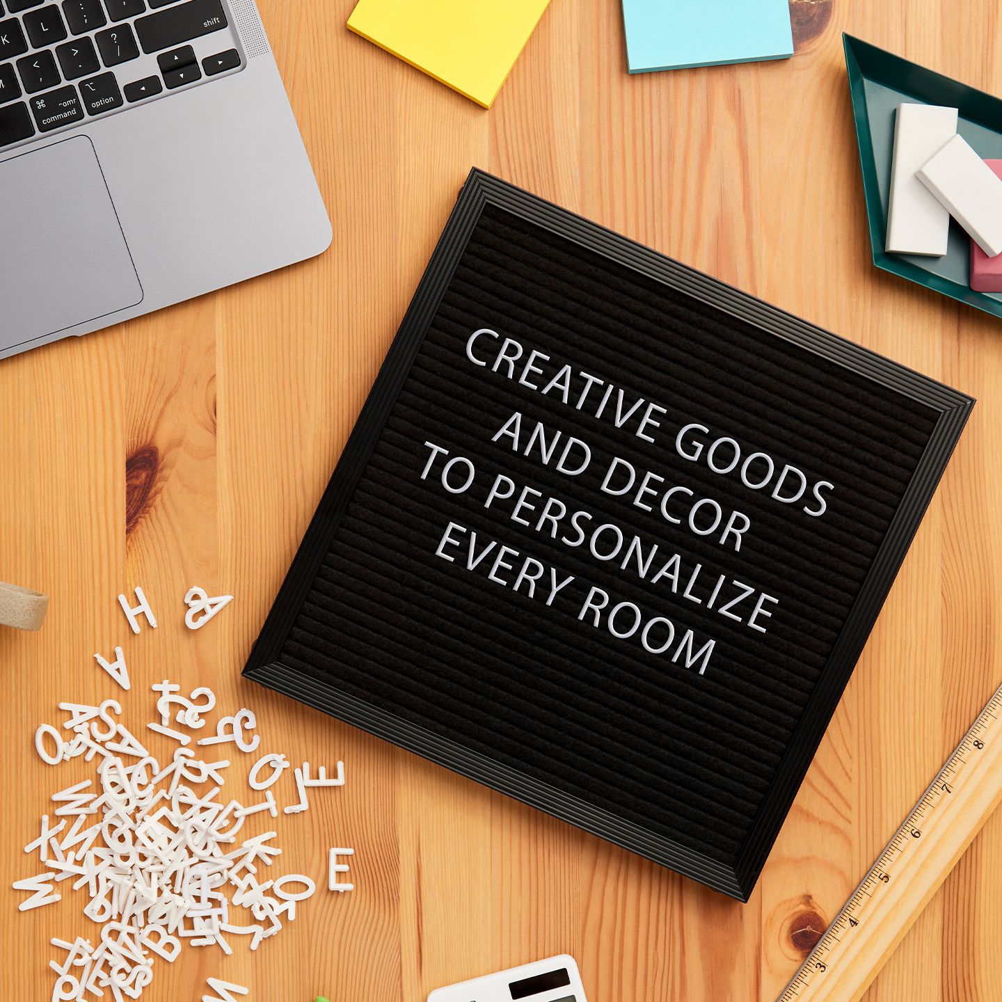 A Letter Board with a generic messaging that has desk items around the edges.