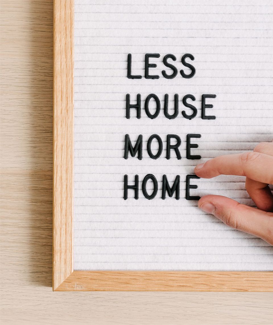 Someone placing a letter on a letter board.
