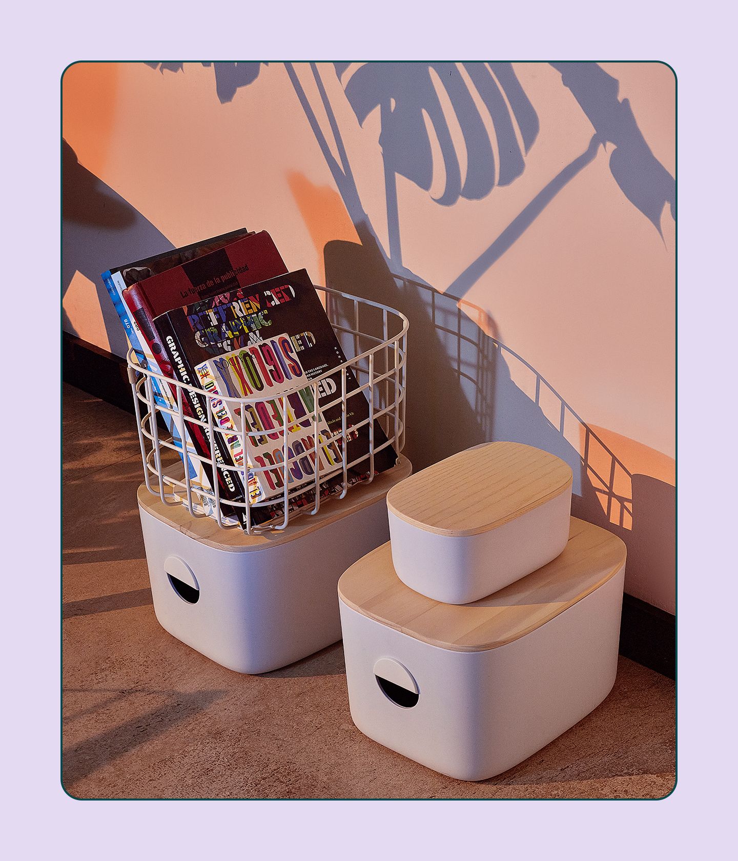 Open Spaces bins and baskets on a wooden floor background.