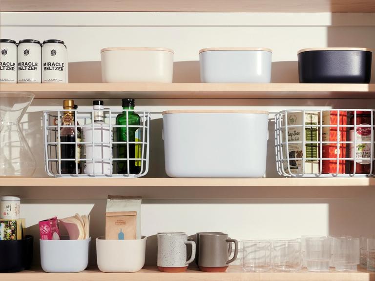 A pantry with various Open Spaces bins and baskets.