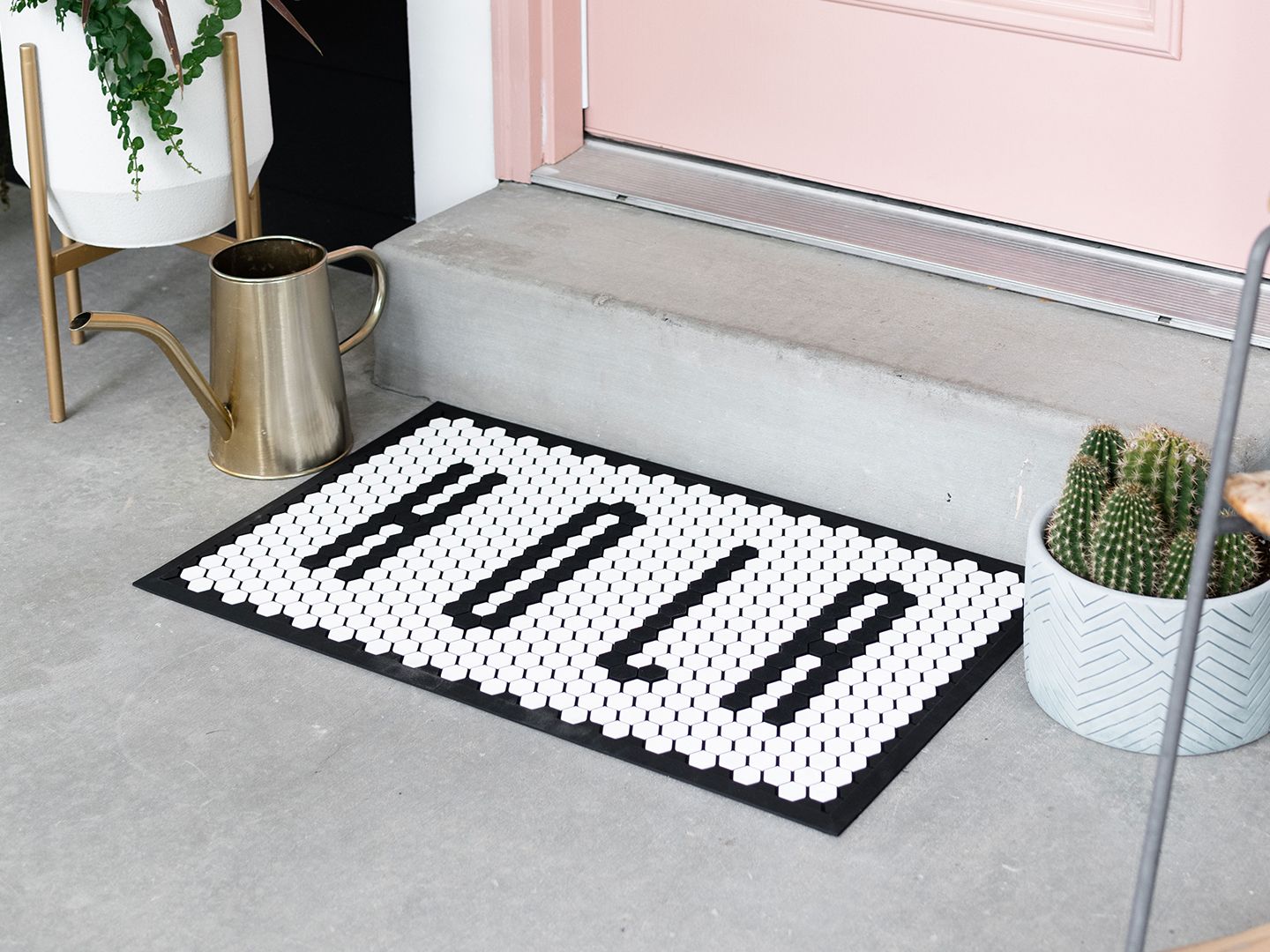 A tile mat being used as a door mat