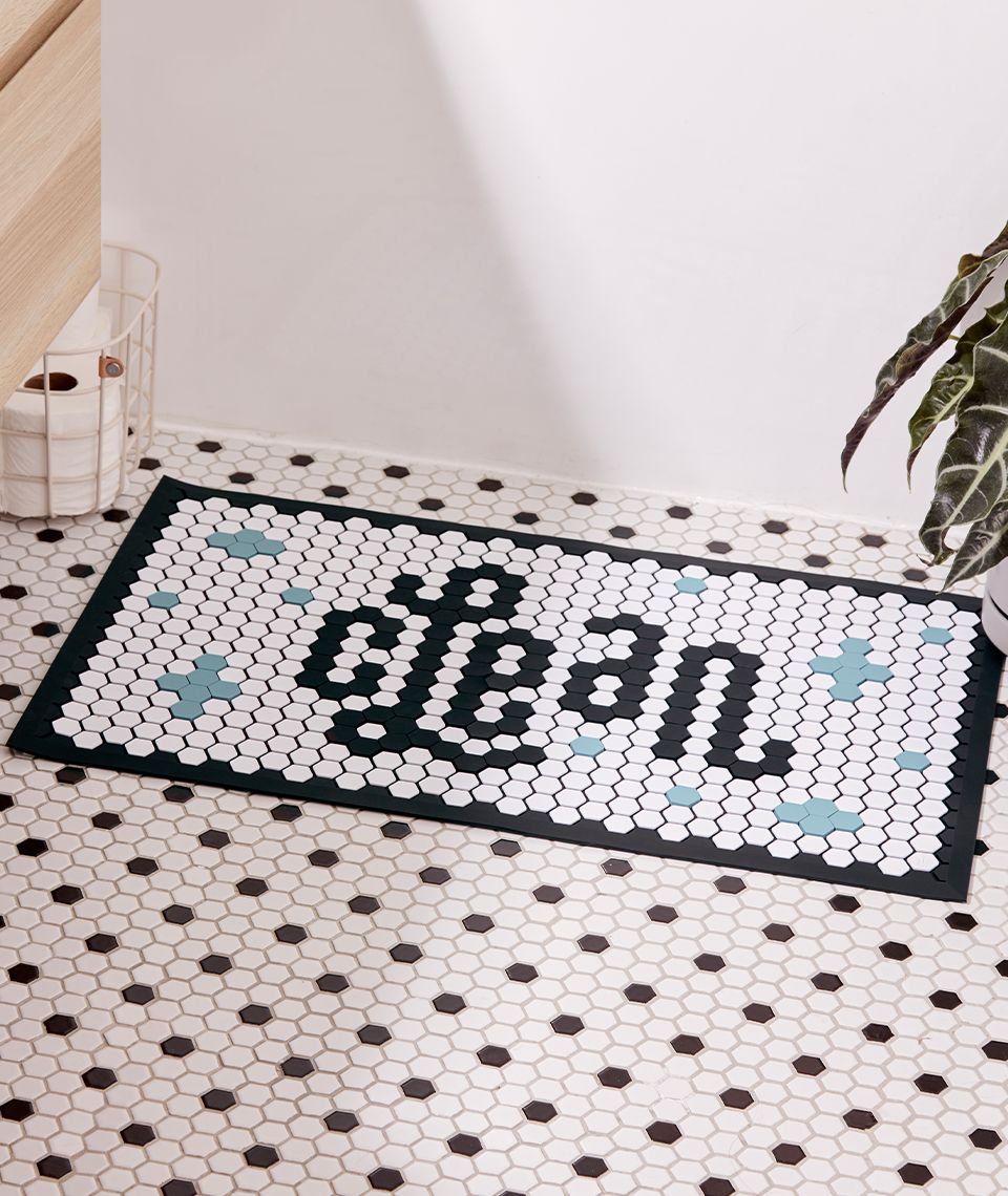 Letterfolk Tile Mat shown in bathroom use