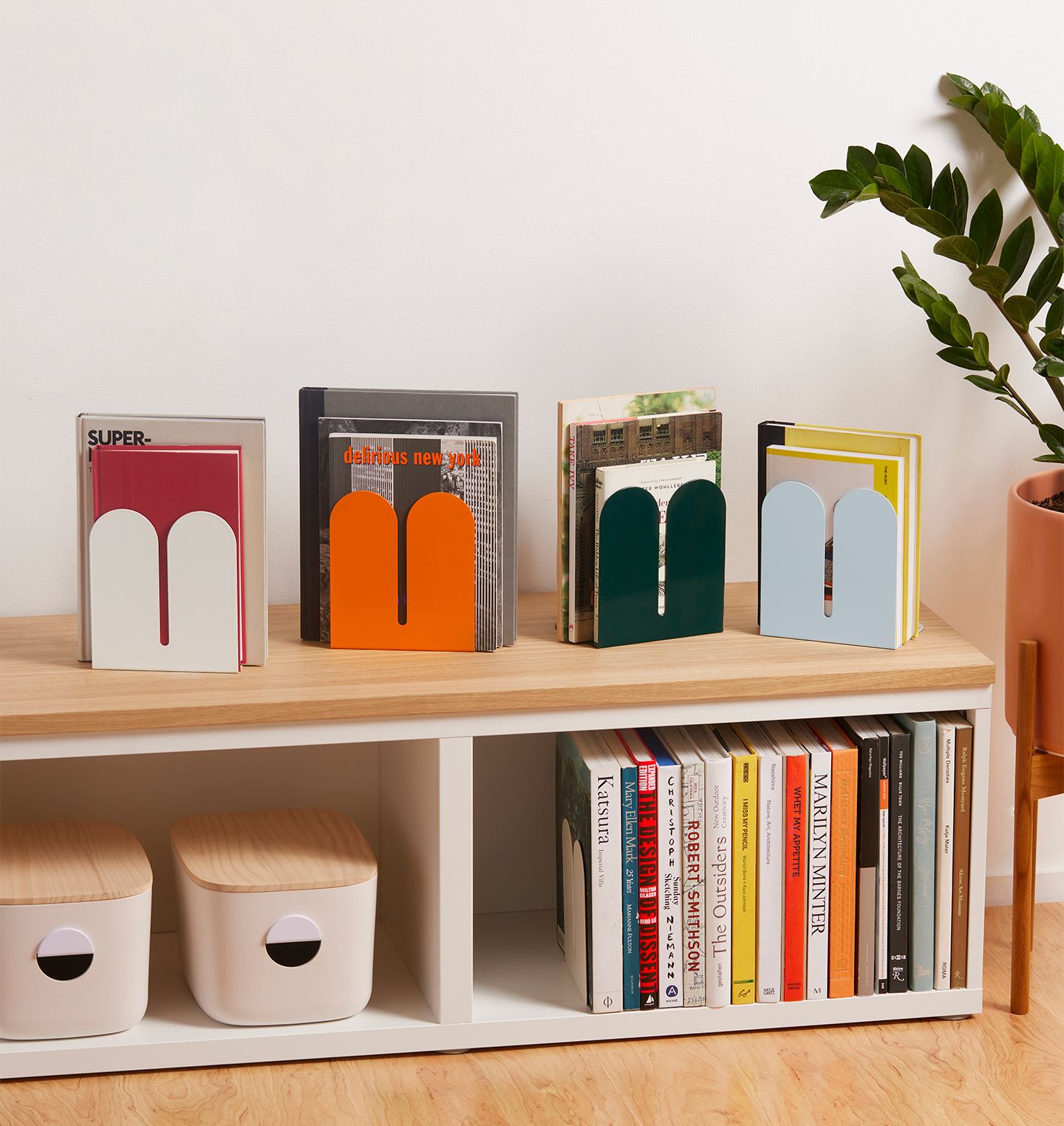 A bookstand with Tortuga bookends hold up magazines and books.