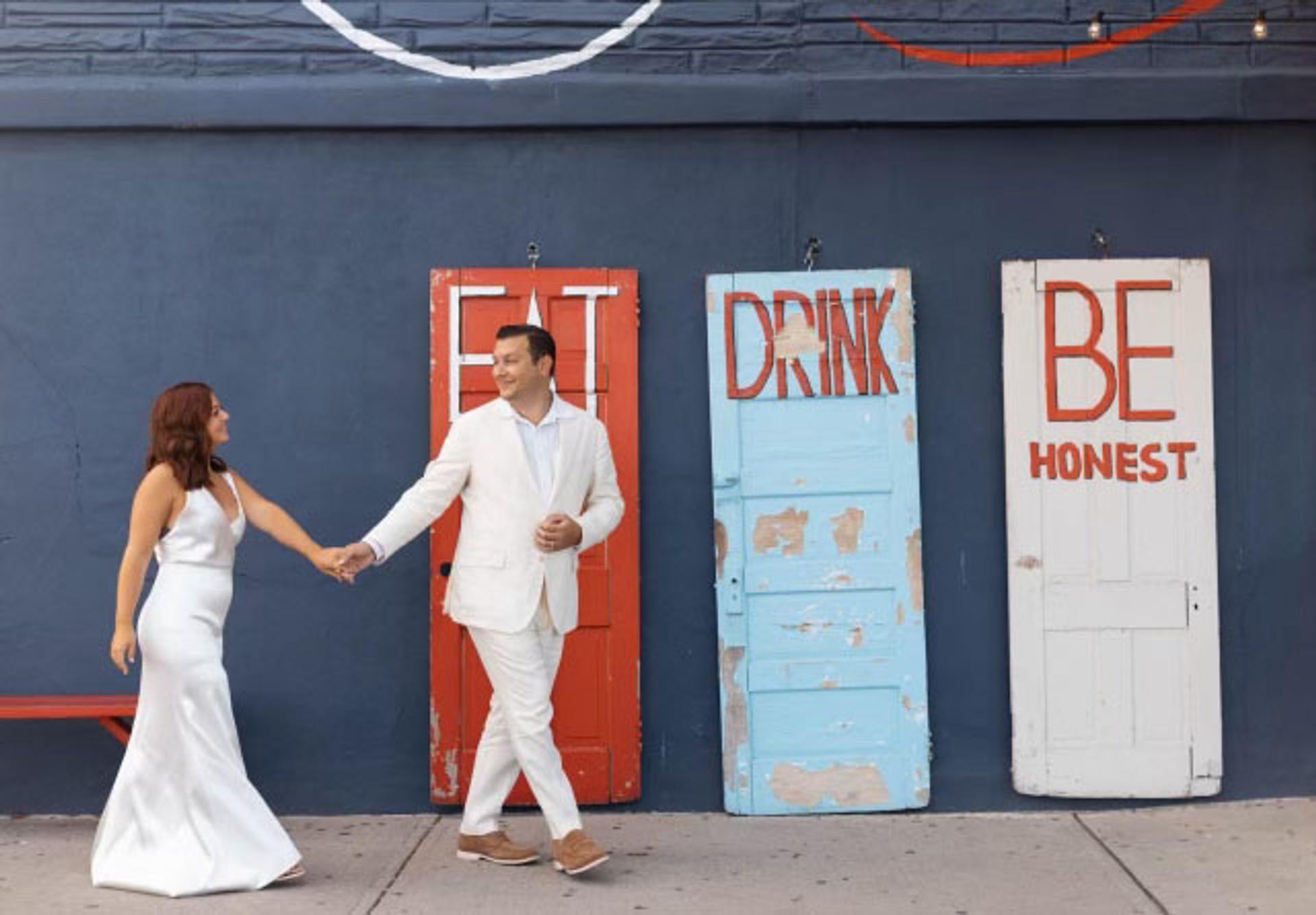 Photo of wedding couple in front of Porta Asbury Park