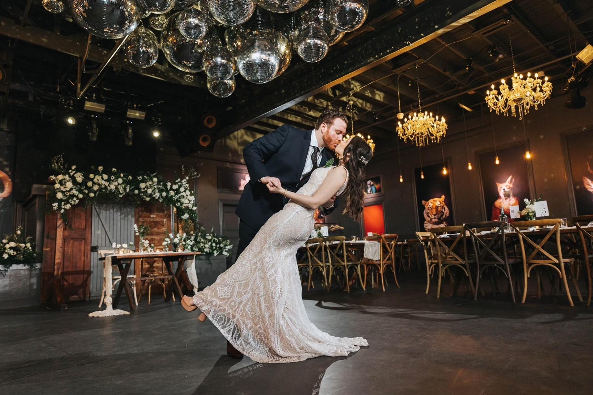 Photo of bride and groom kiss