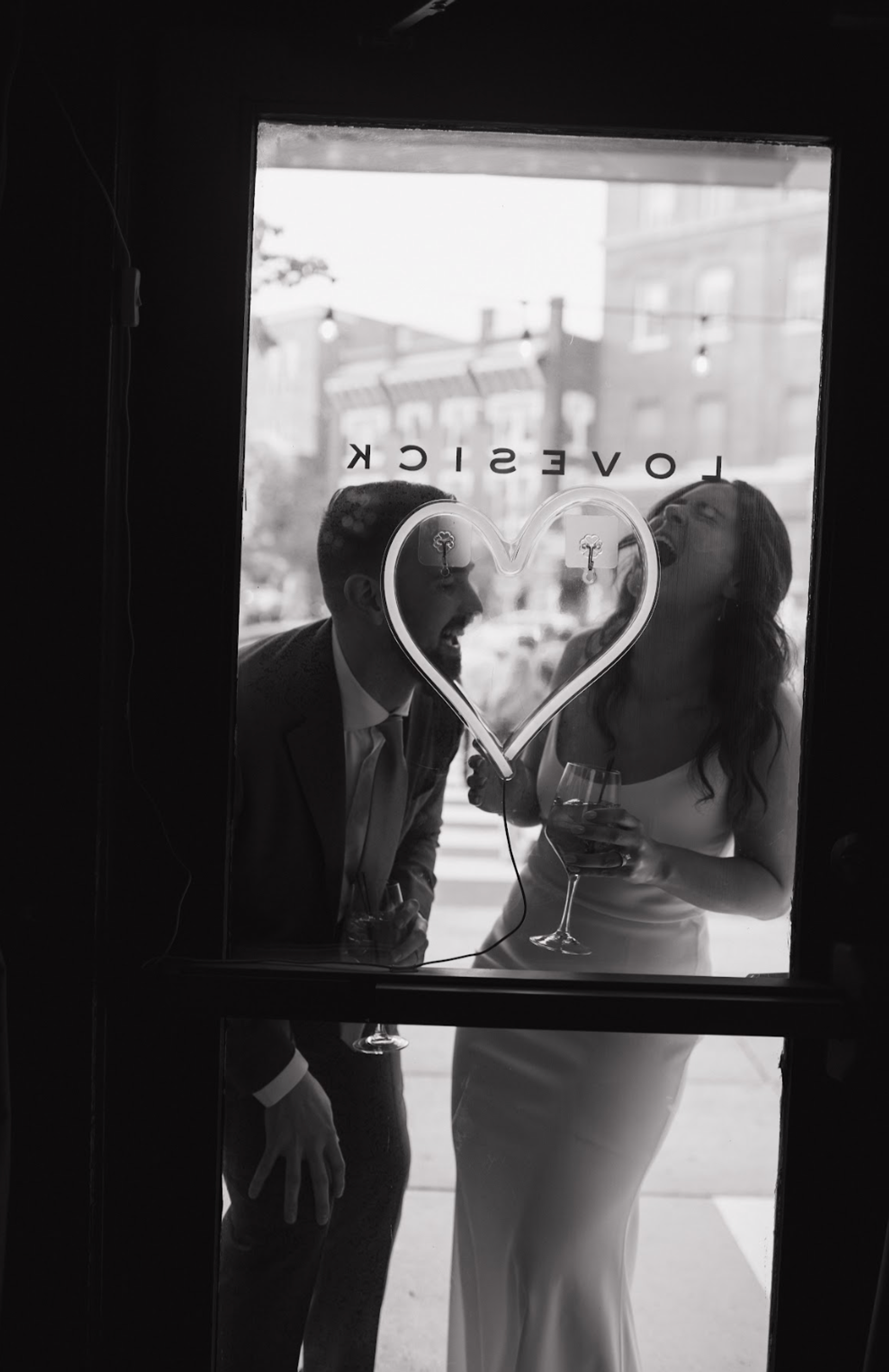 Photo of wedding couple through front door