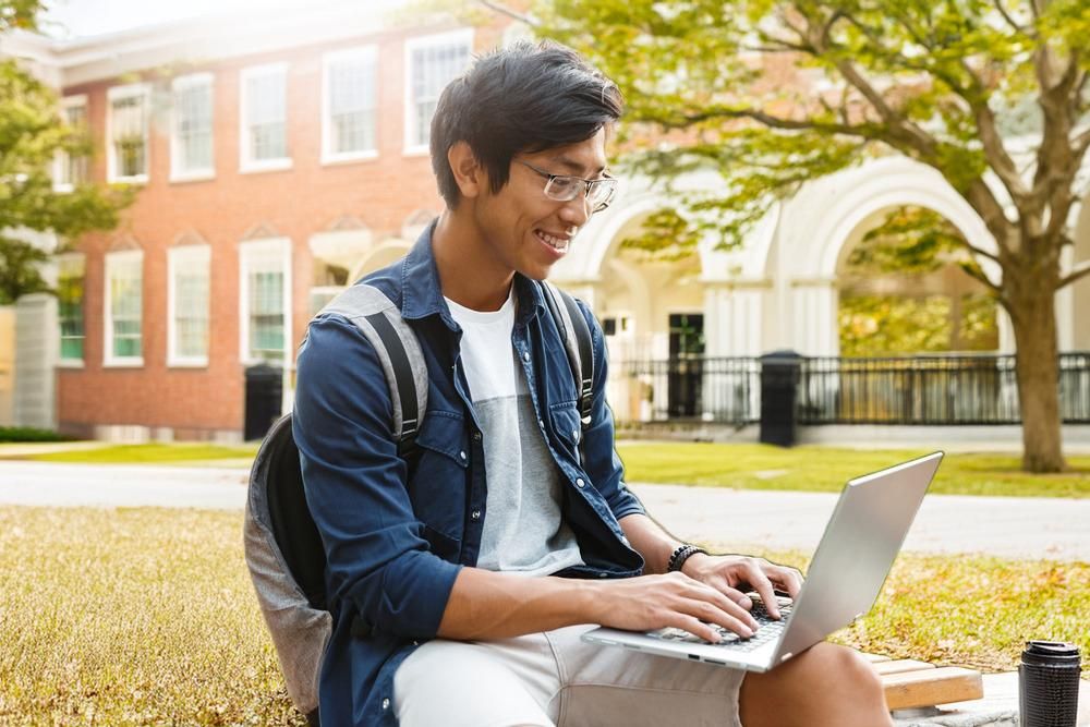 College student doing work on a laptop