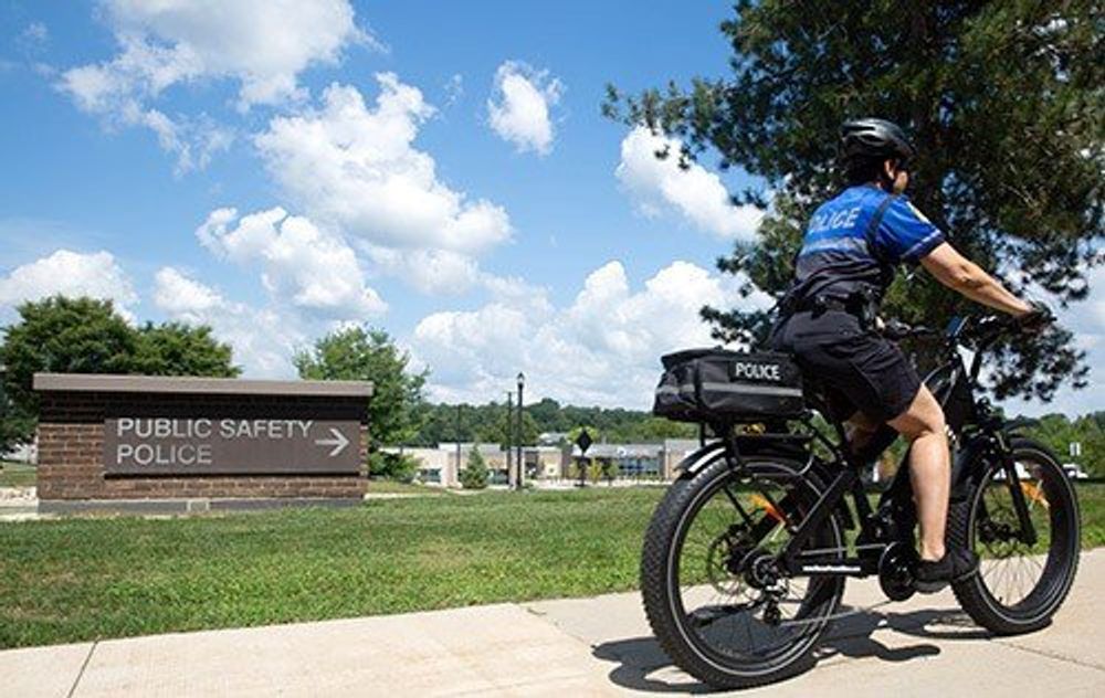 Poster for GameAbove gifts two new e-bikes to Eastern Michigan University’s Department of Public Safety