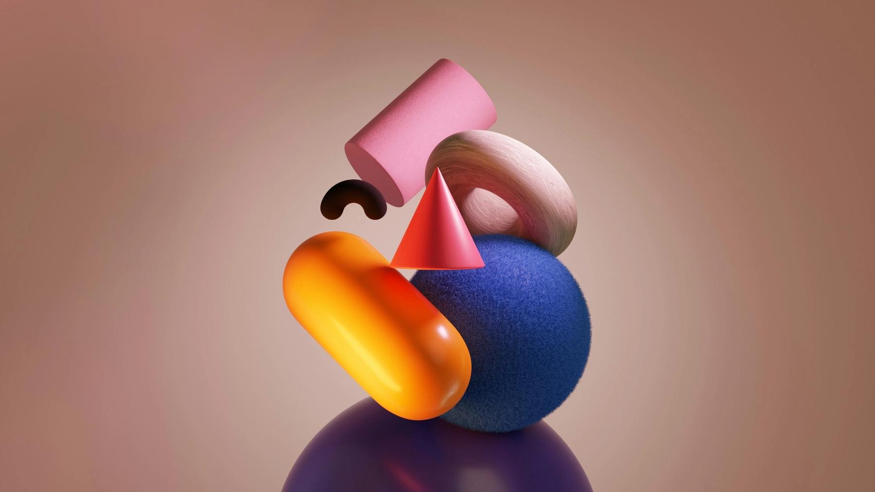 Colourful three-dimensional shapes stacked on top of each other against a warm background.