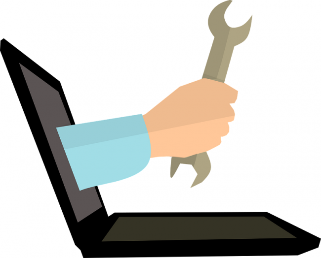 An illustration of a spanner coming out of a laptop to symbolize the concept of learning tools for L&D professionals