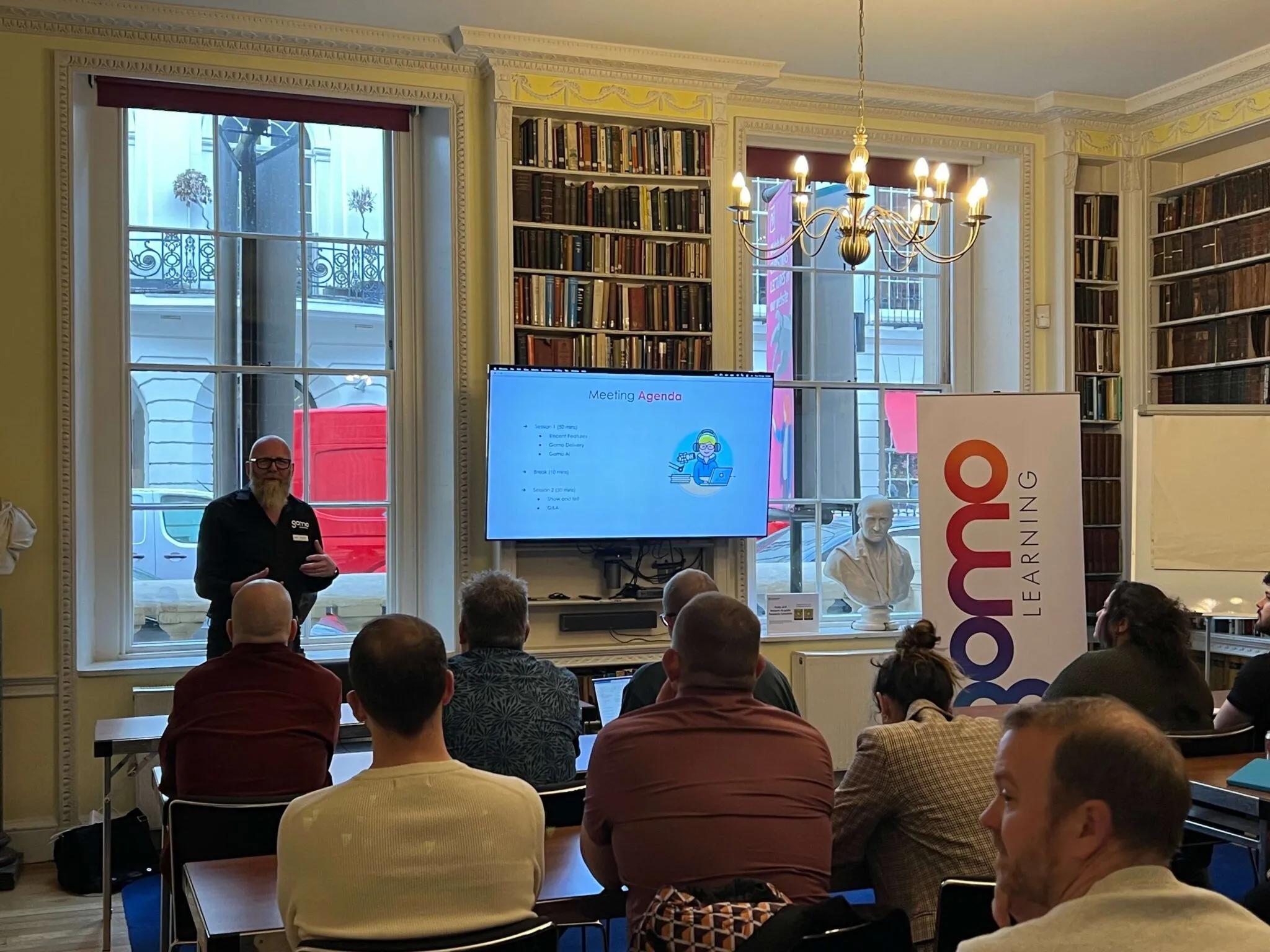 Gomo's Huw Edwards talking to the audience about Gomo's roadmap and AI capabilities at Gomo Live in London