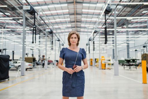 A leader standing alone in a warehouse, a staging that may be suitable for an individualist culture.