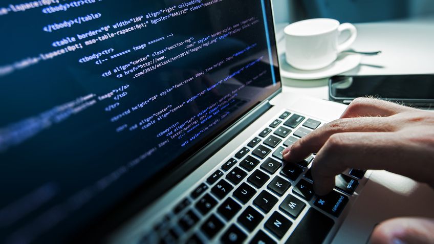 Photo of HTML being edited on a laptop