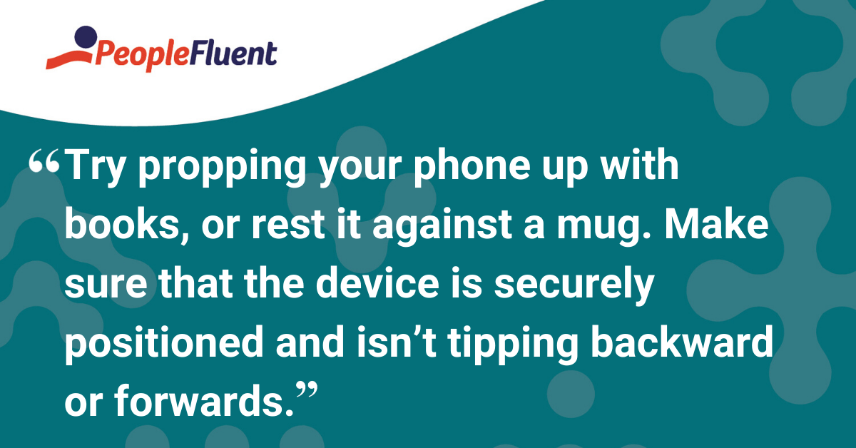 Try propping your phone up with books, or rest it against a mug. Make sure that the device is securely positioned and isn’t tipping backward or forwards.