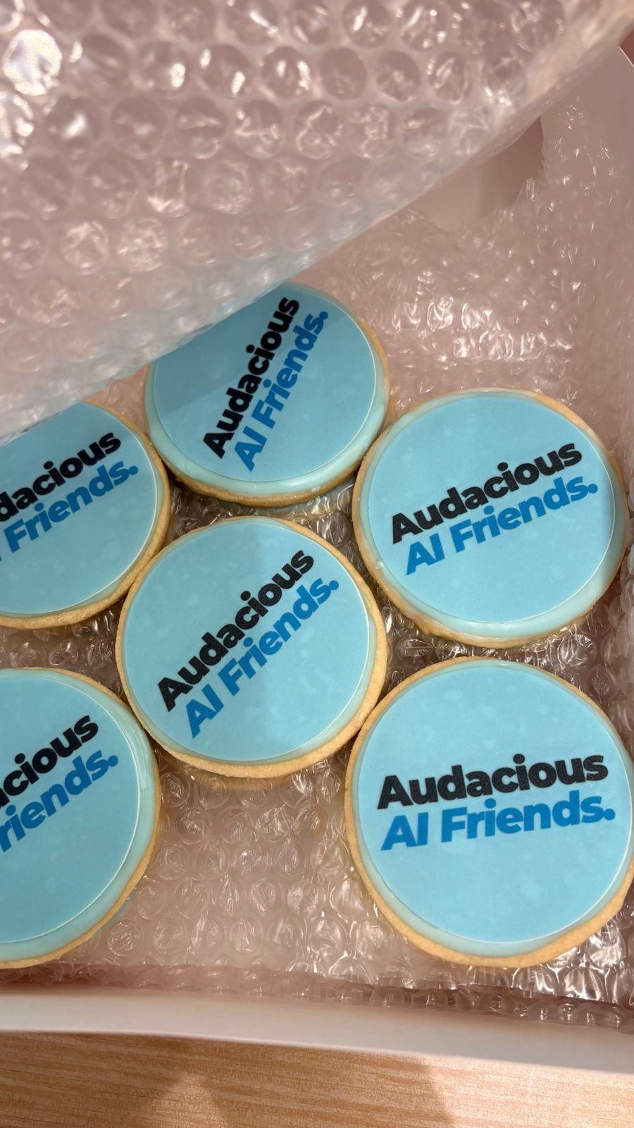 Cookies iced with the Audacious AI Friends logo