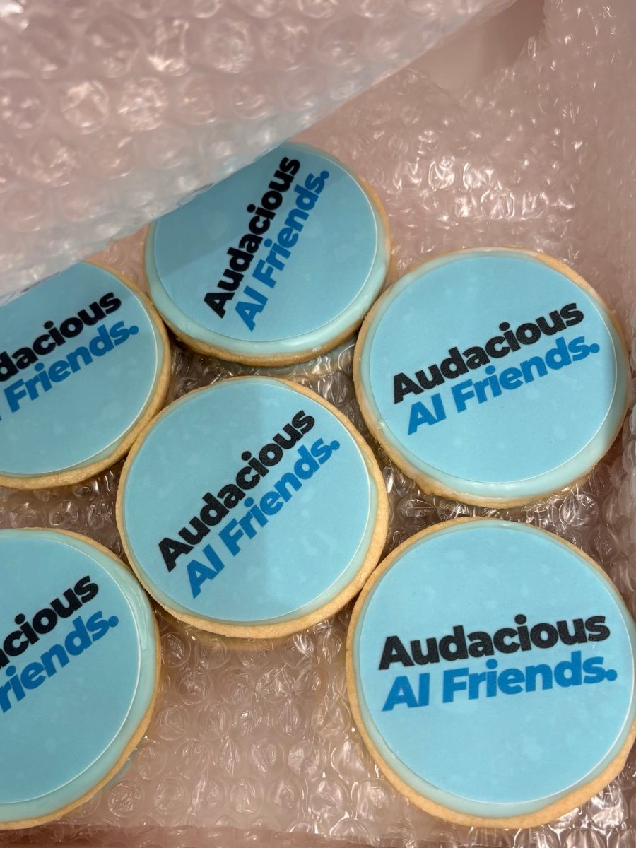 Cookies iced with the Audacious AI Friends logo