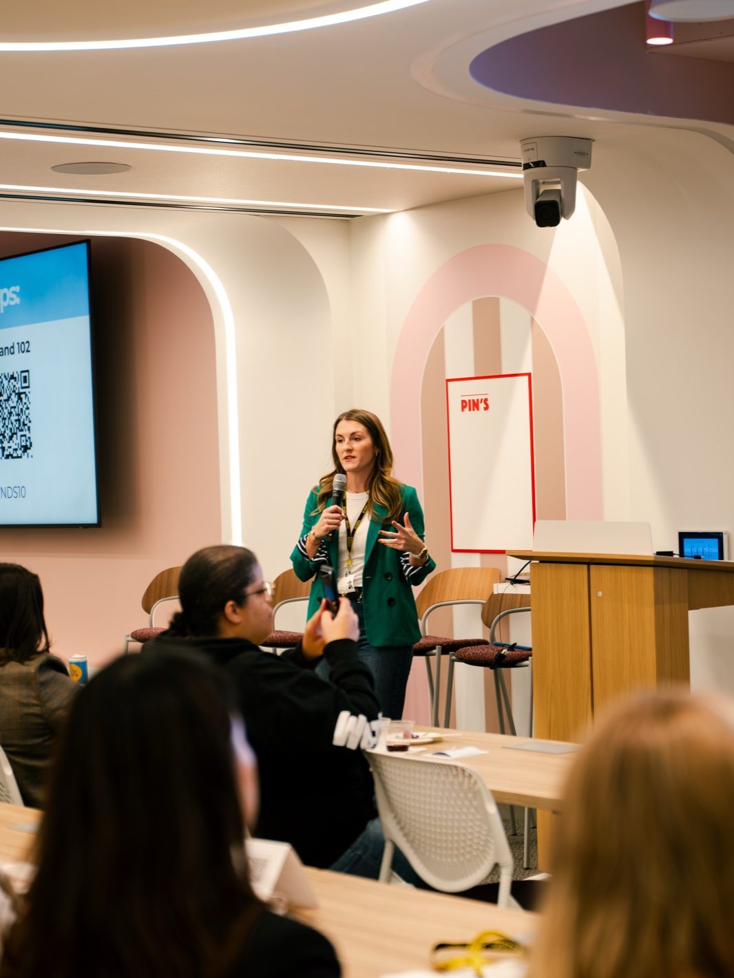 A speaker presenting at the AI Skills Share at Pinterest NY