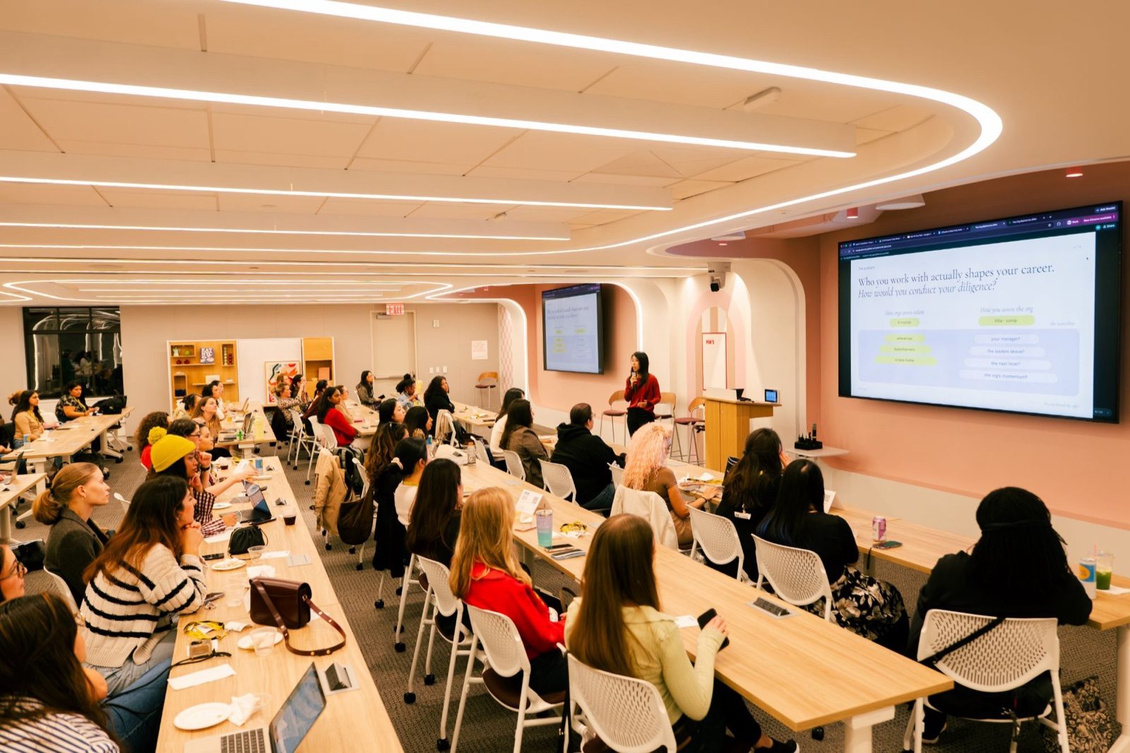 A speaker presenting to a full room at the AI Skills Share at Pinterest NY