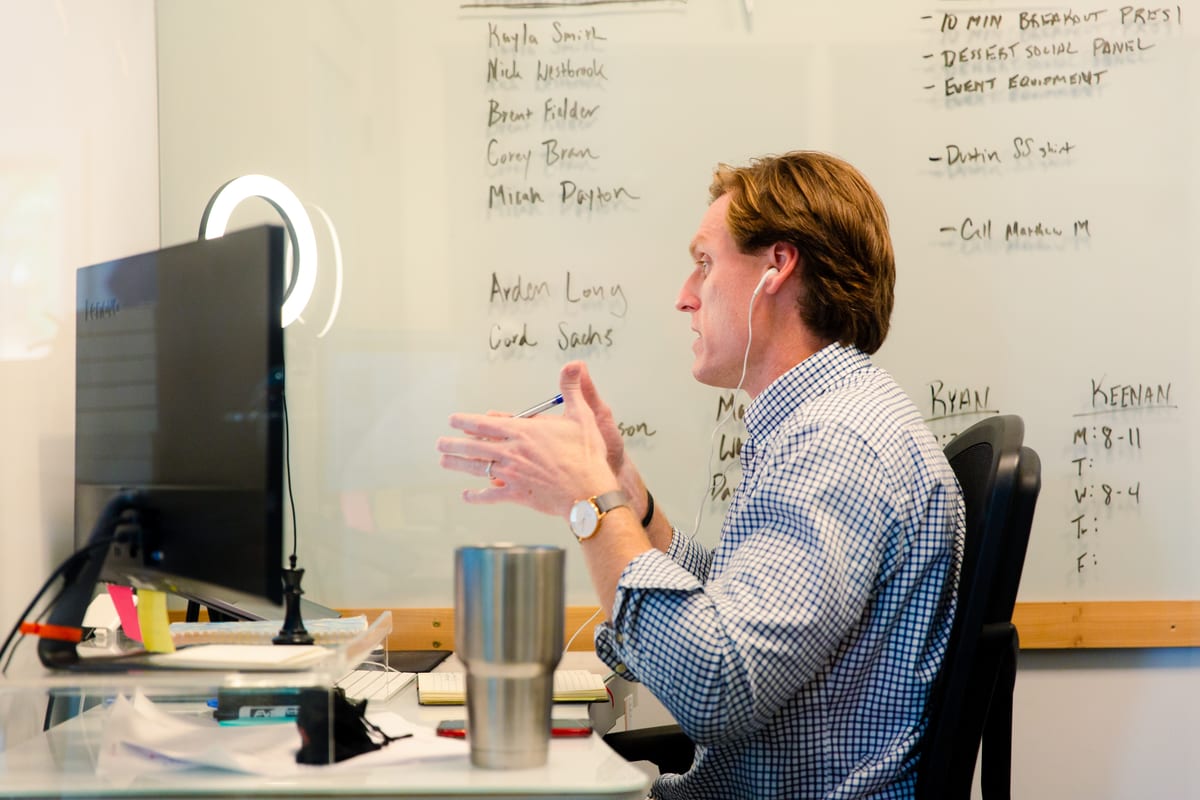 A FireSeeds consultant working through a search pipeline on a whiteboard