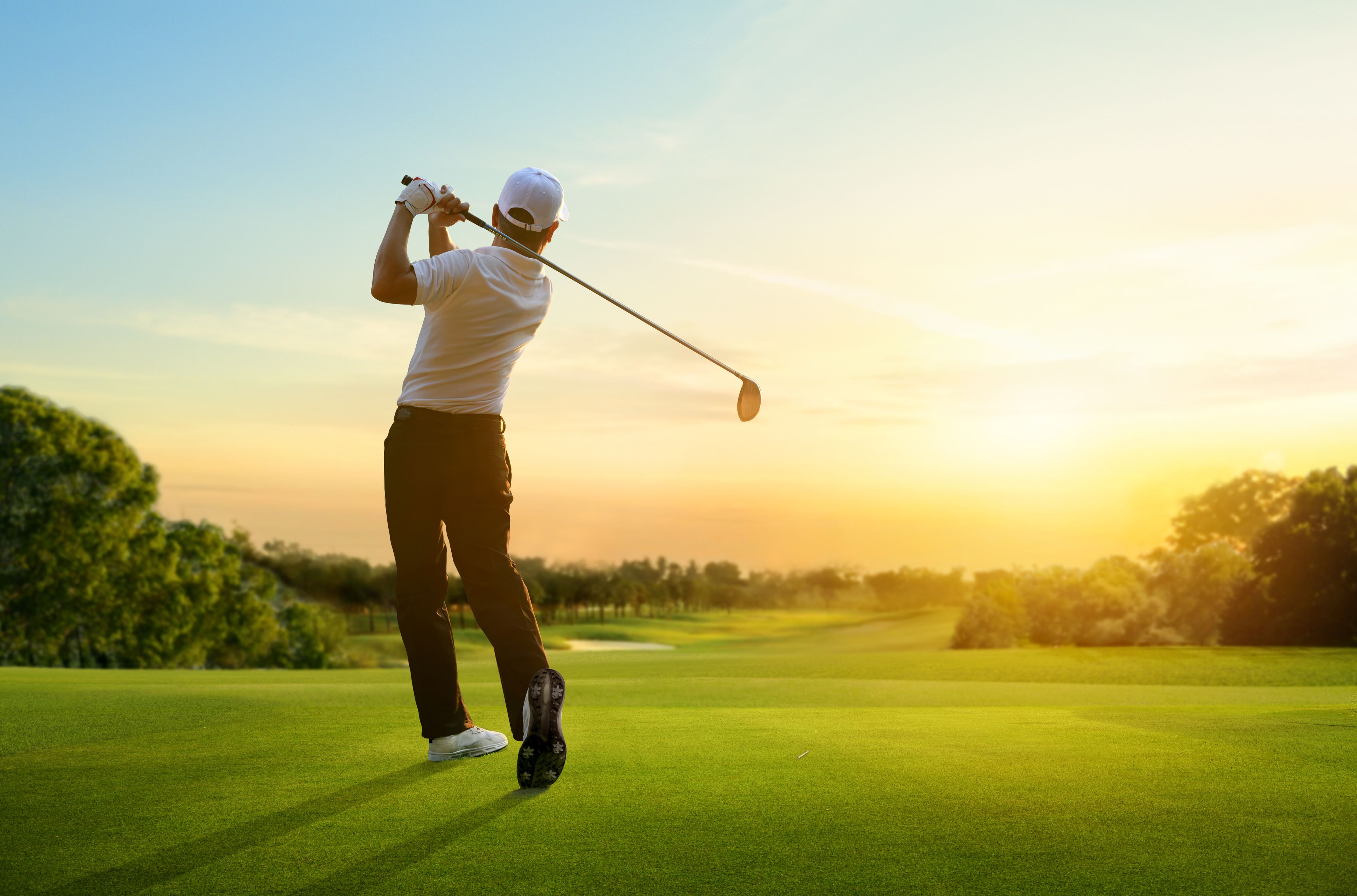 Golfer hitting a ball