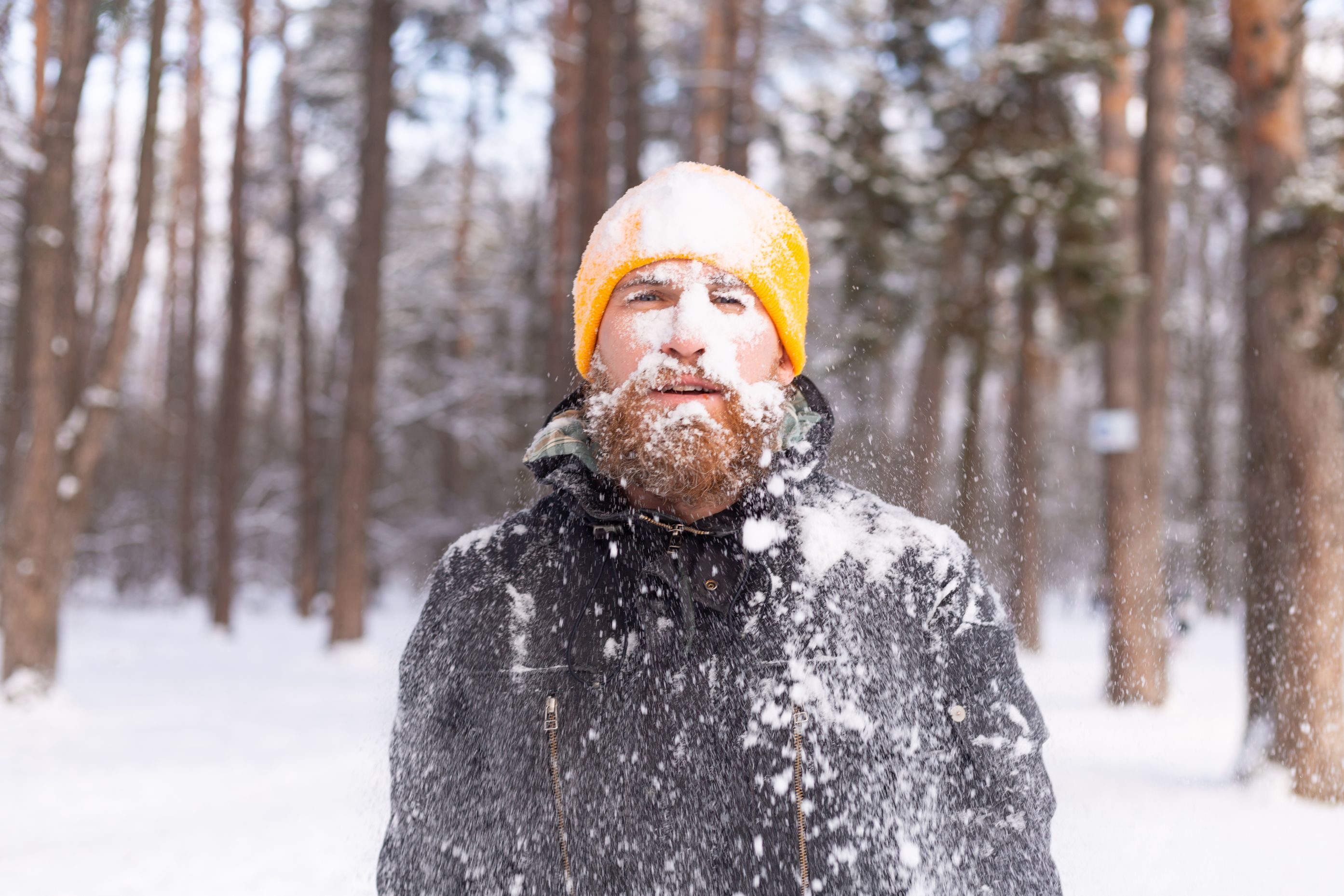 Adult man completely  covered in snow