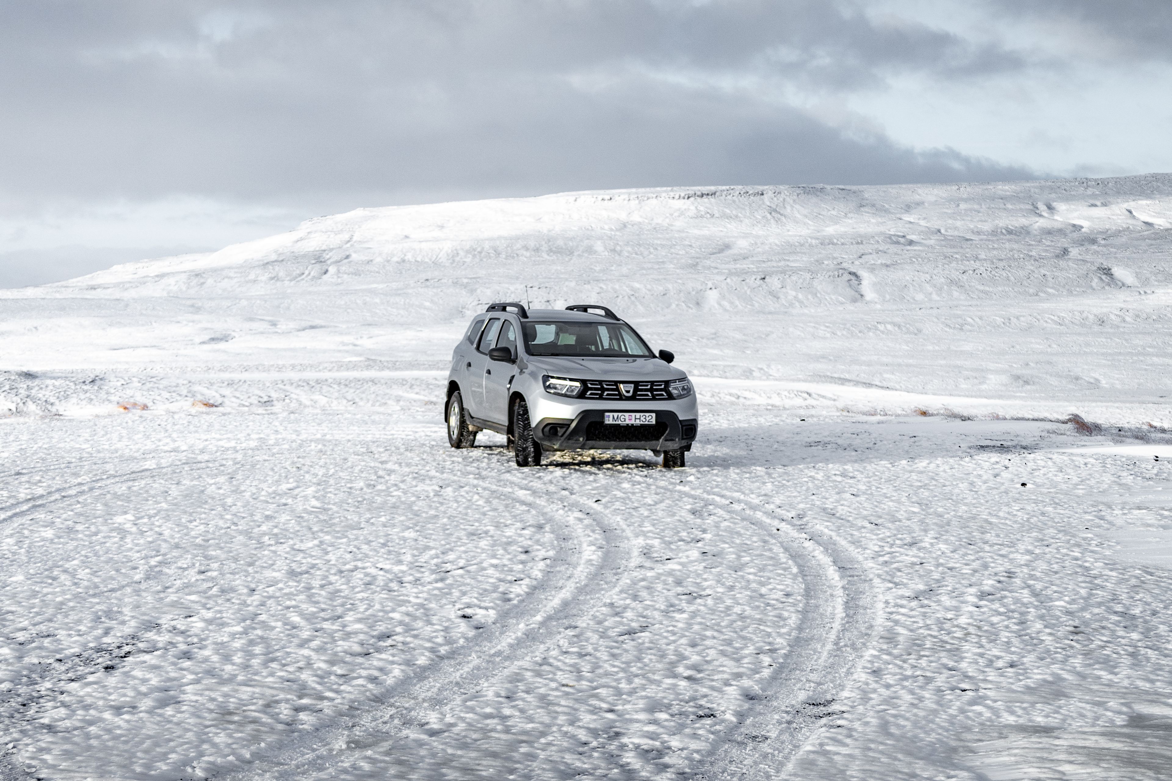 A Dacia Duster driving in winter in Iceland