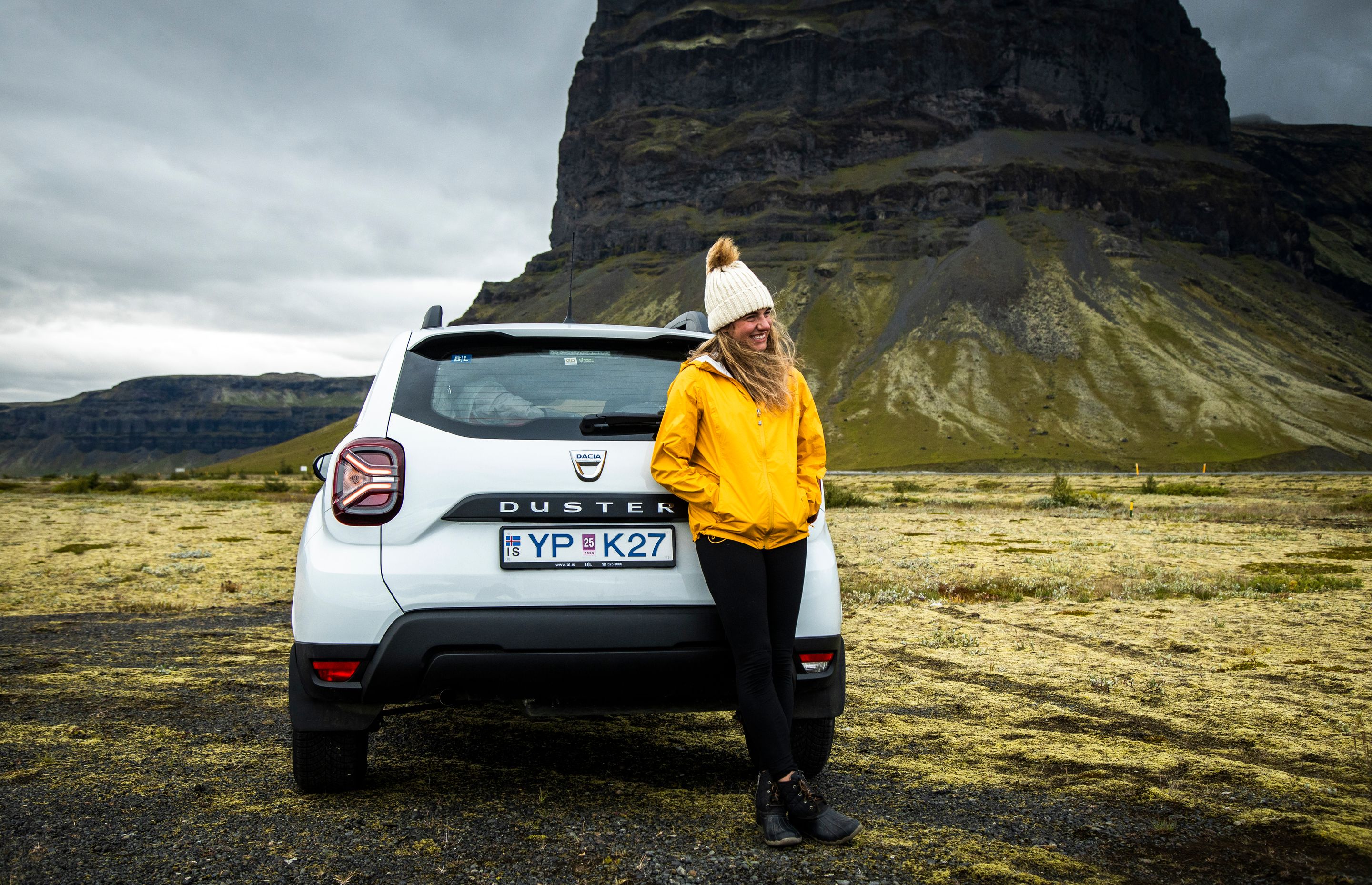 Person standing in front of a Dacia Duster in Iceland 