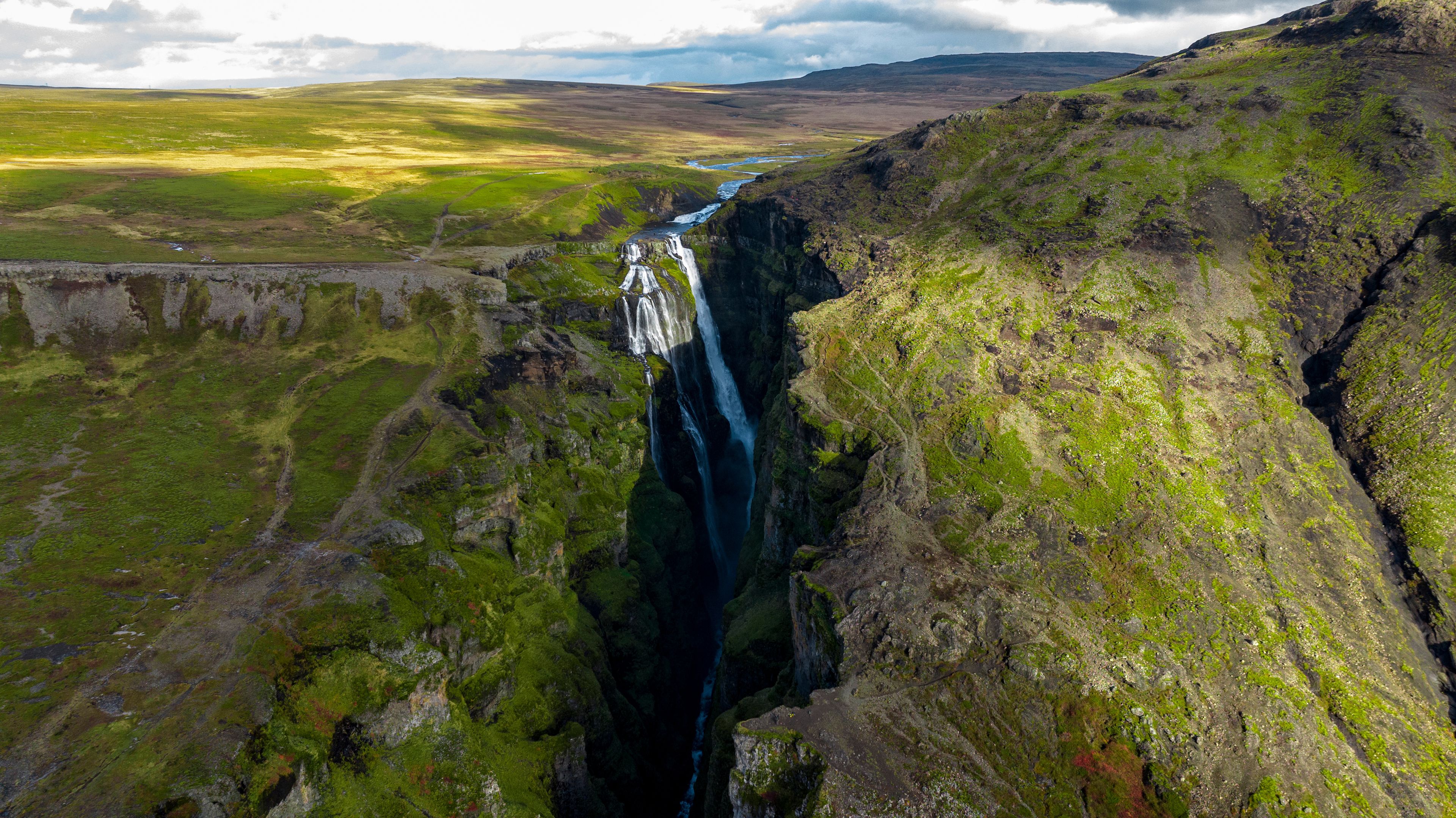 Aerial view of Glymur Canyon with its towering waterfall