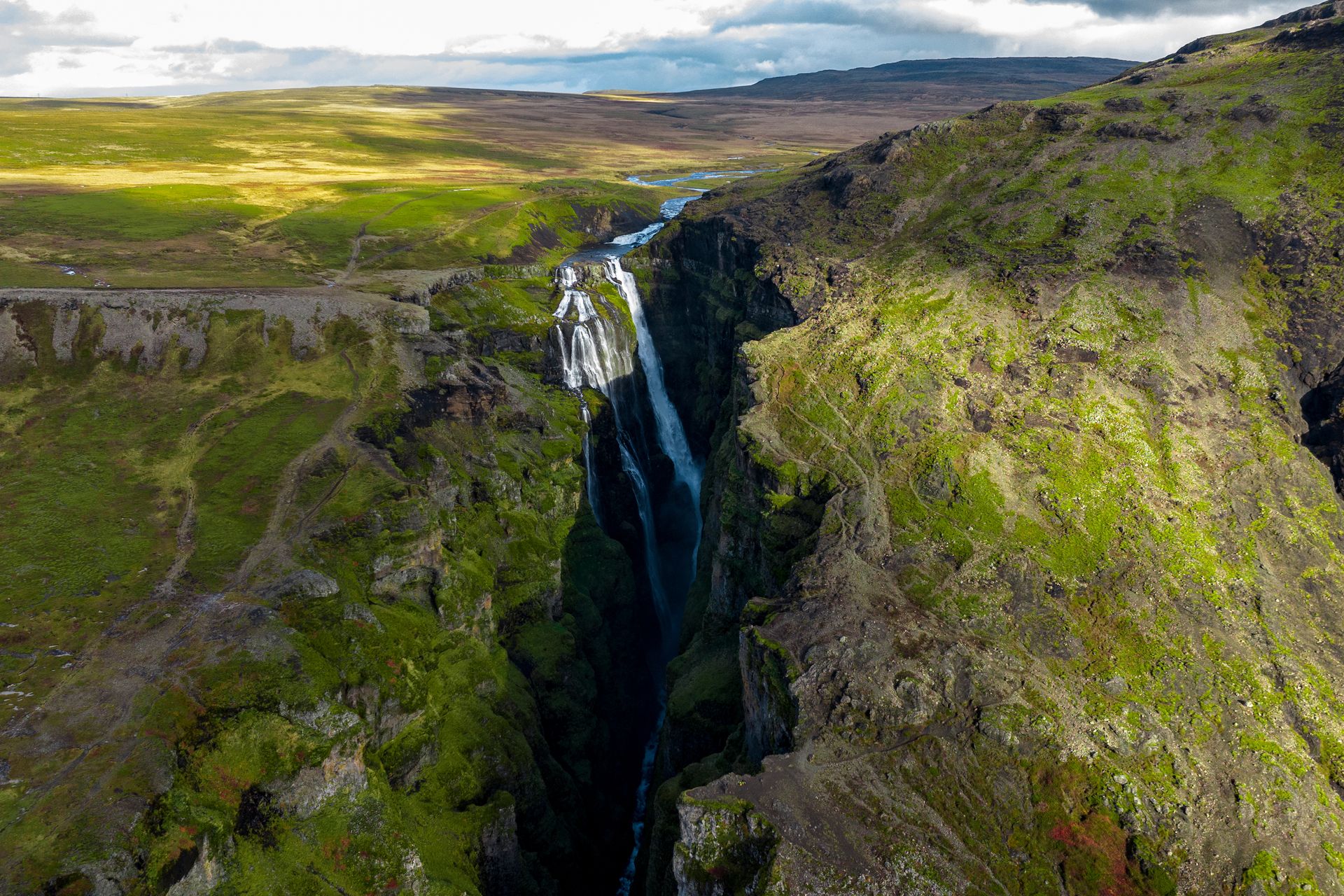 Aerial view of Glymur Canyon with its towering waterfall