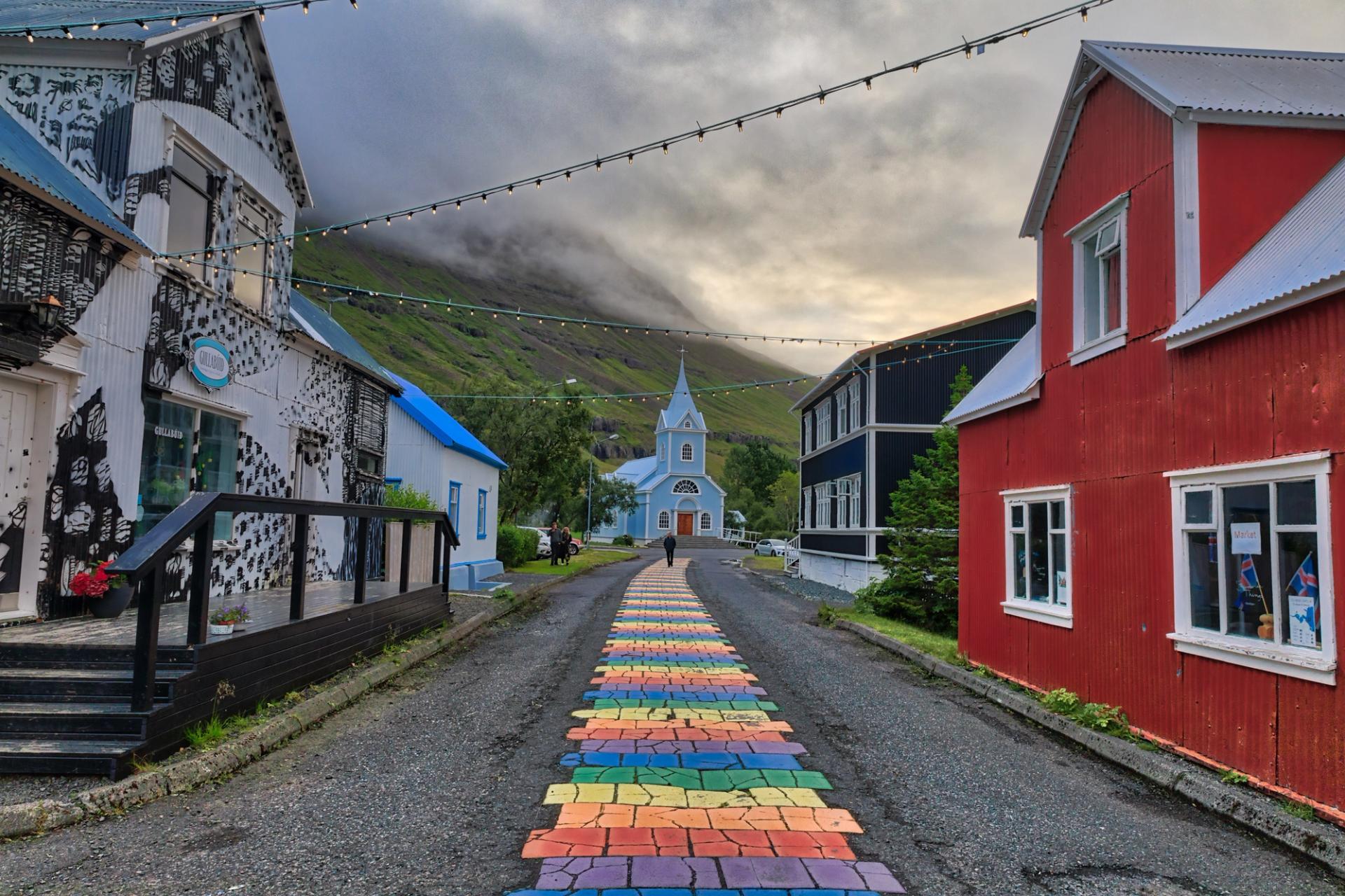 Rainbow pathway in center of town to Seyðisfjarðarkirkja Church