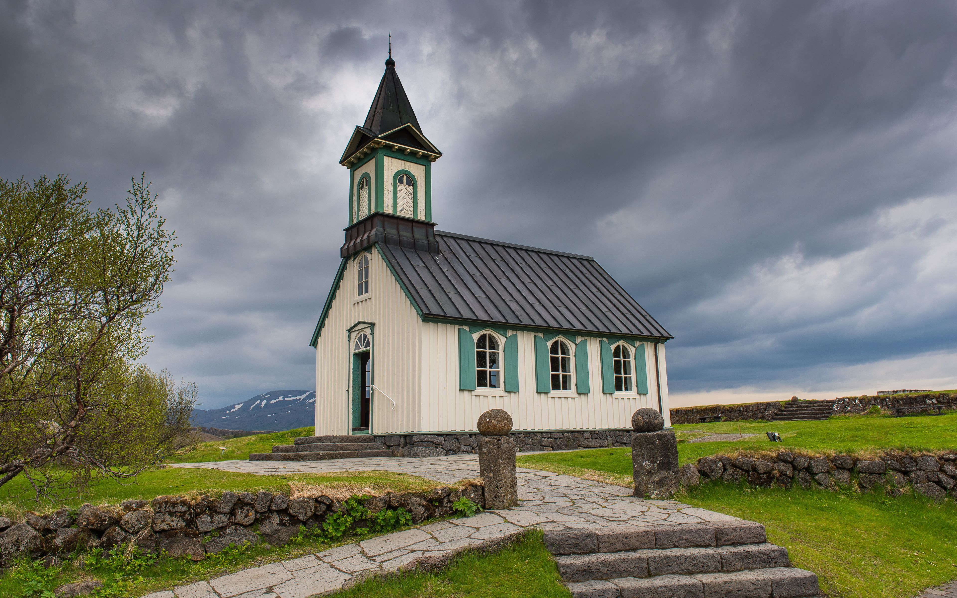 Thingvallakirkja with black clouds in the background