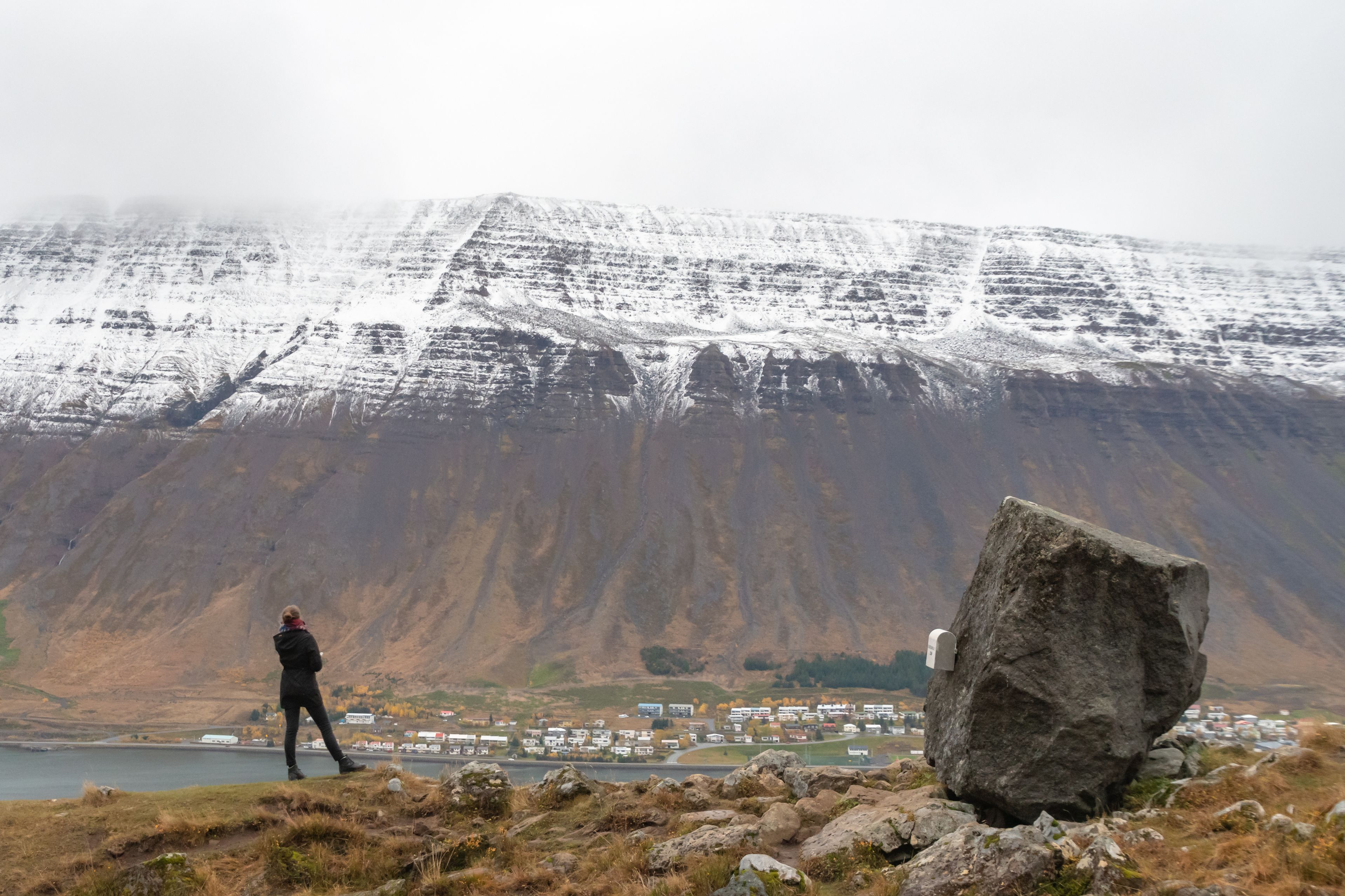 Person in Troll's seat overlooking Isafjordur