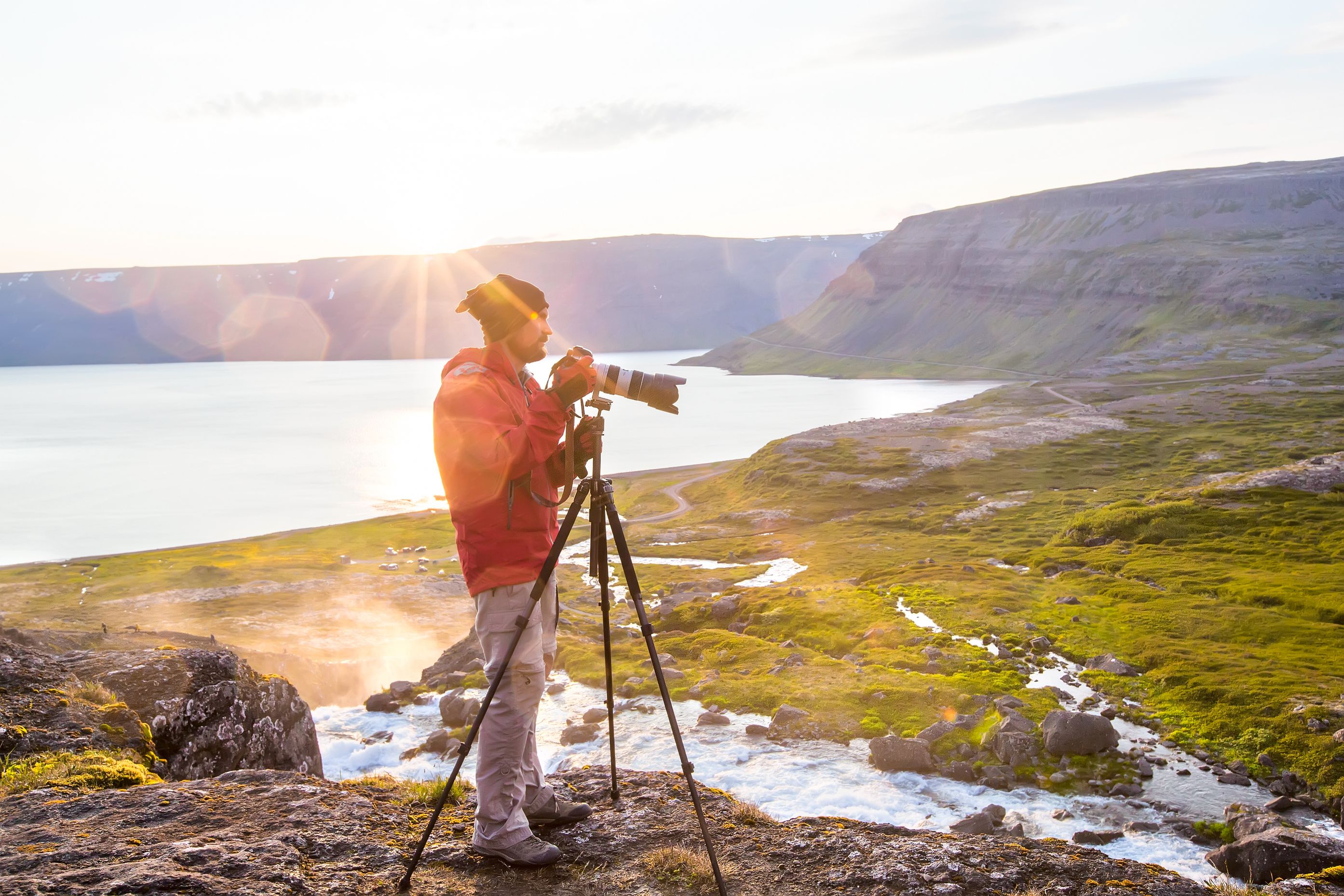 a photopgrapher taking pictures of Iceland's landscapes and its sunset