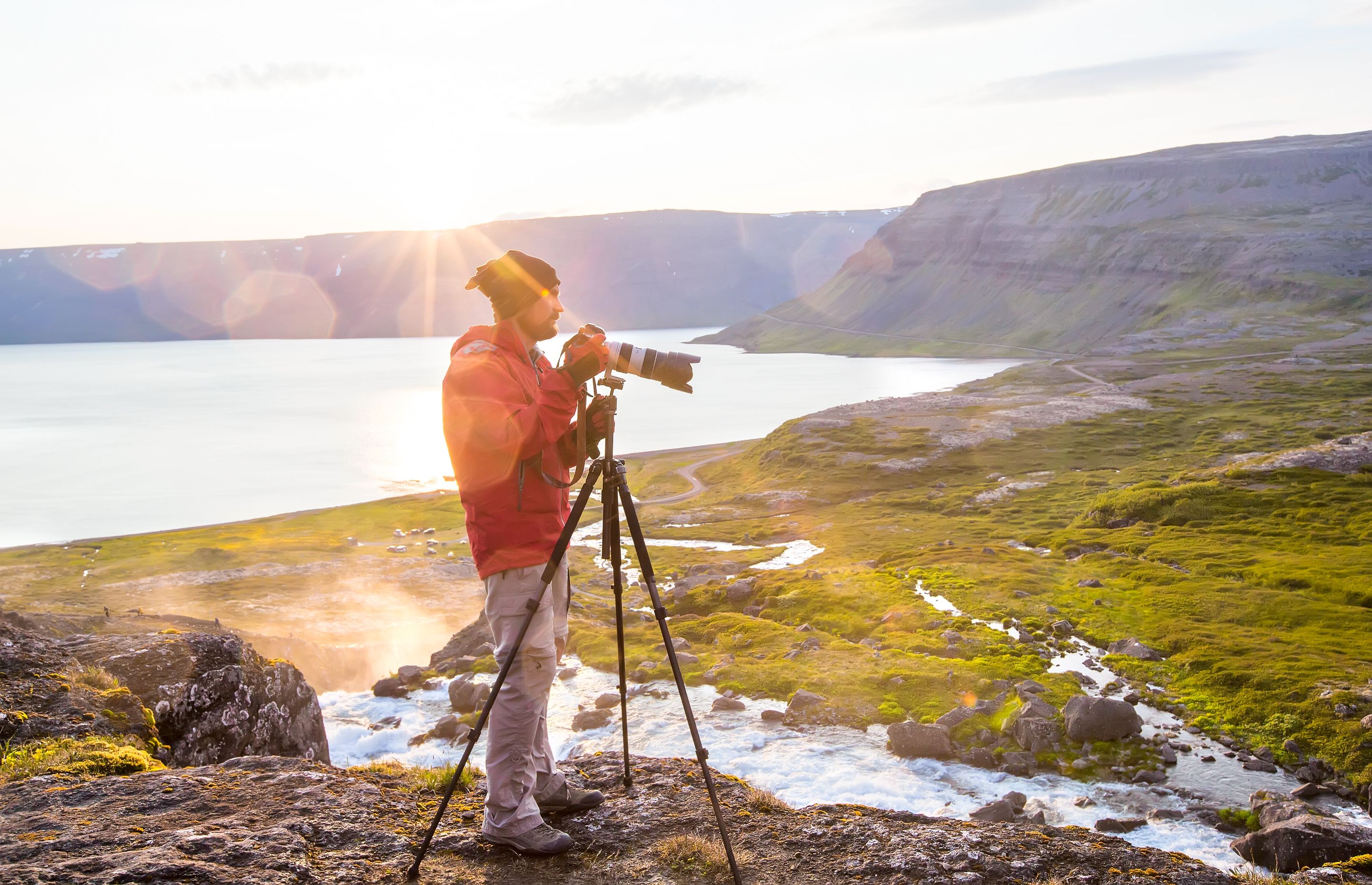 a photopgrapher taking pictures of Iceland's landscapes and its sunset