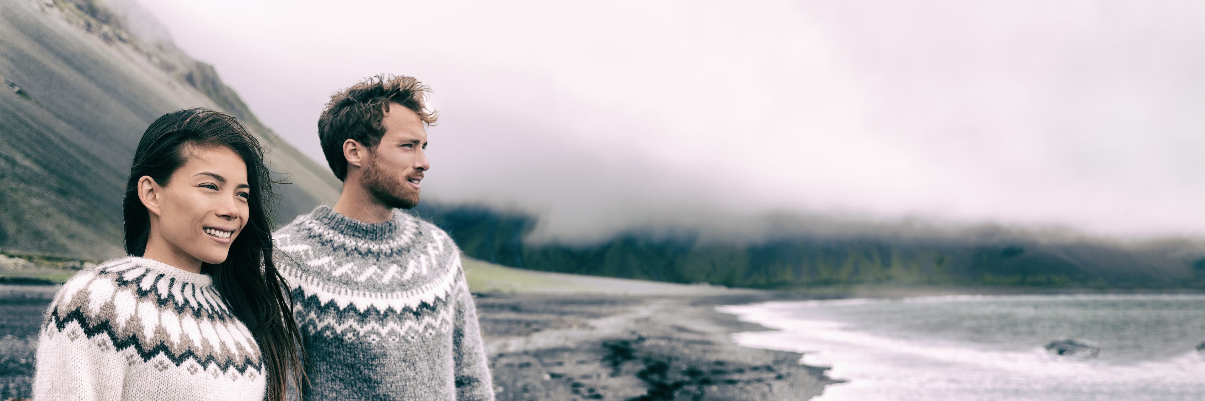 Couple in Iceland wearing merino wool sweaters