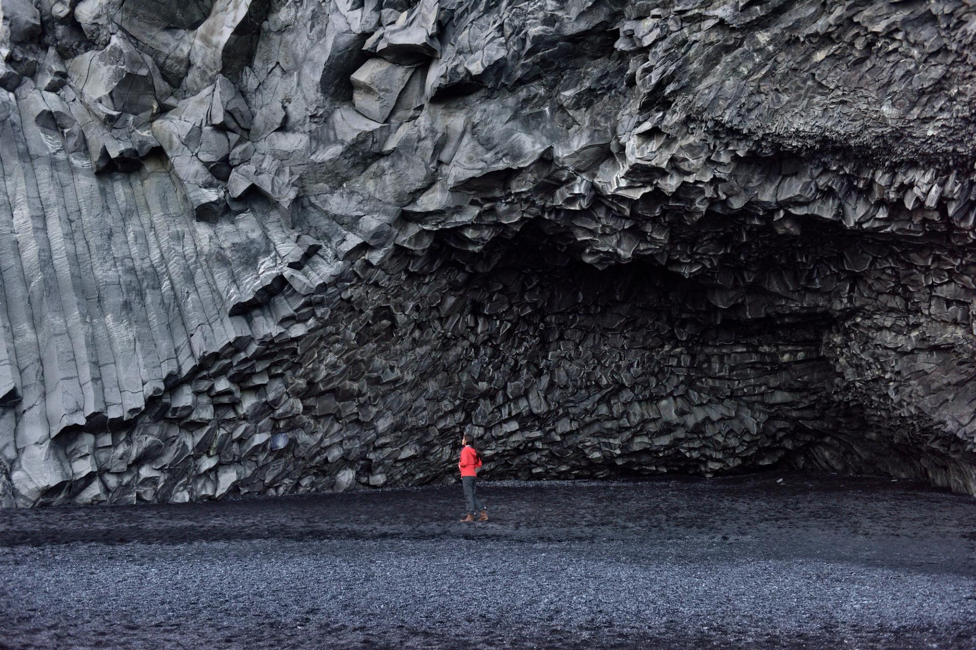 Iceland tourist walking on Reynisfjara black sand beach