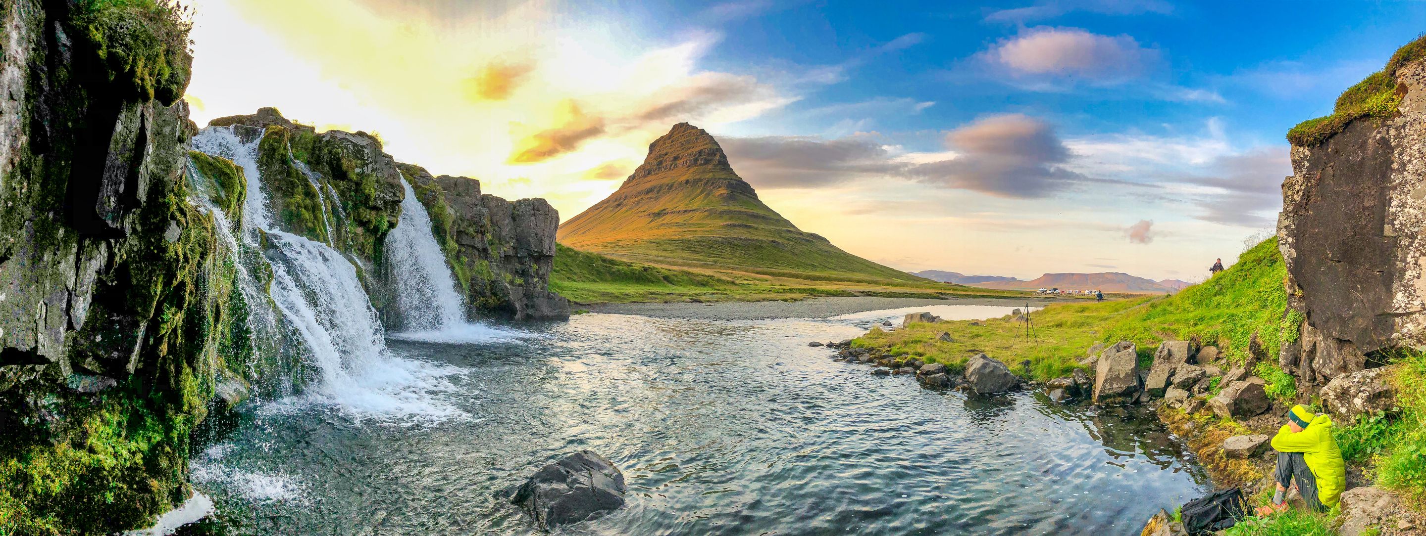 Panoramic picture of Kirkjufellsfoss Waterfall with Kirkjufell Mountain behind it