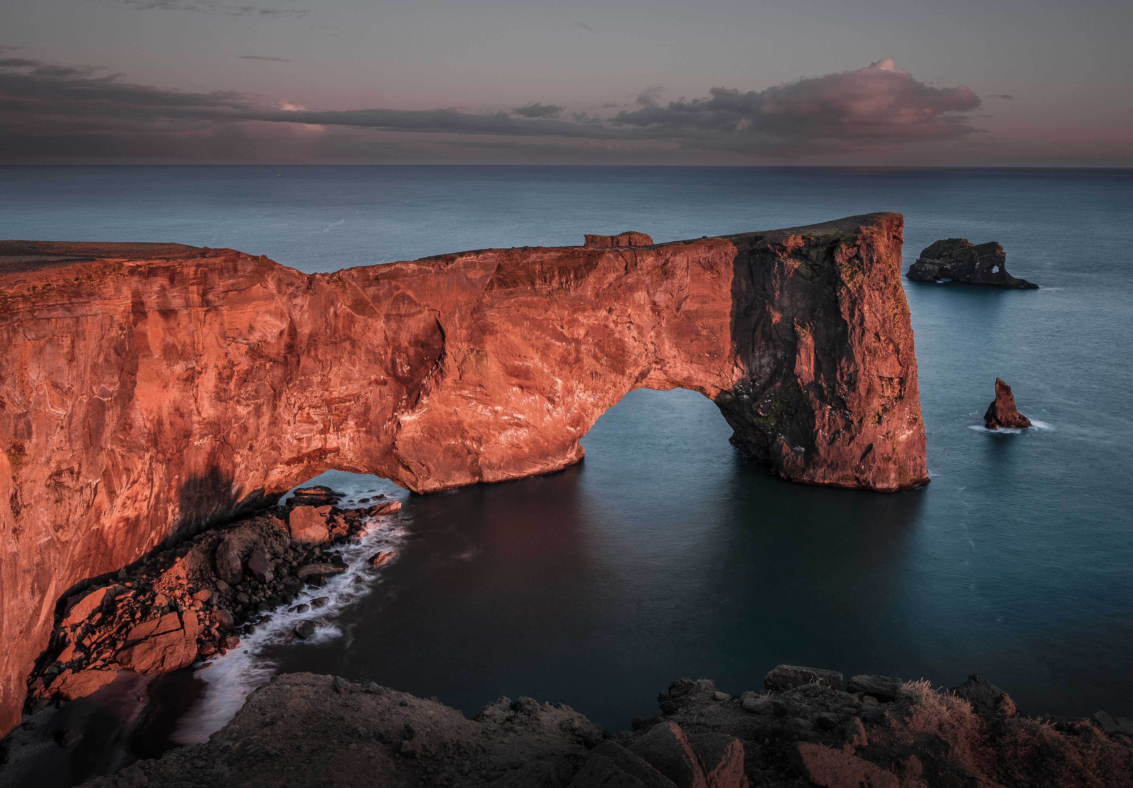 view on the beautiful rock arch at Dyrholaey, Iceland. Dyrholaey means the hill island with the door hole