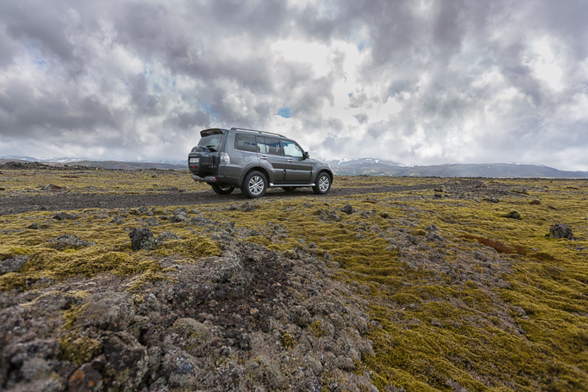 The 4x4 Mitsubishi Pajero driving on a gravel road in iceland