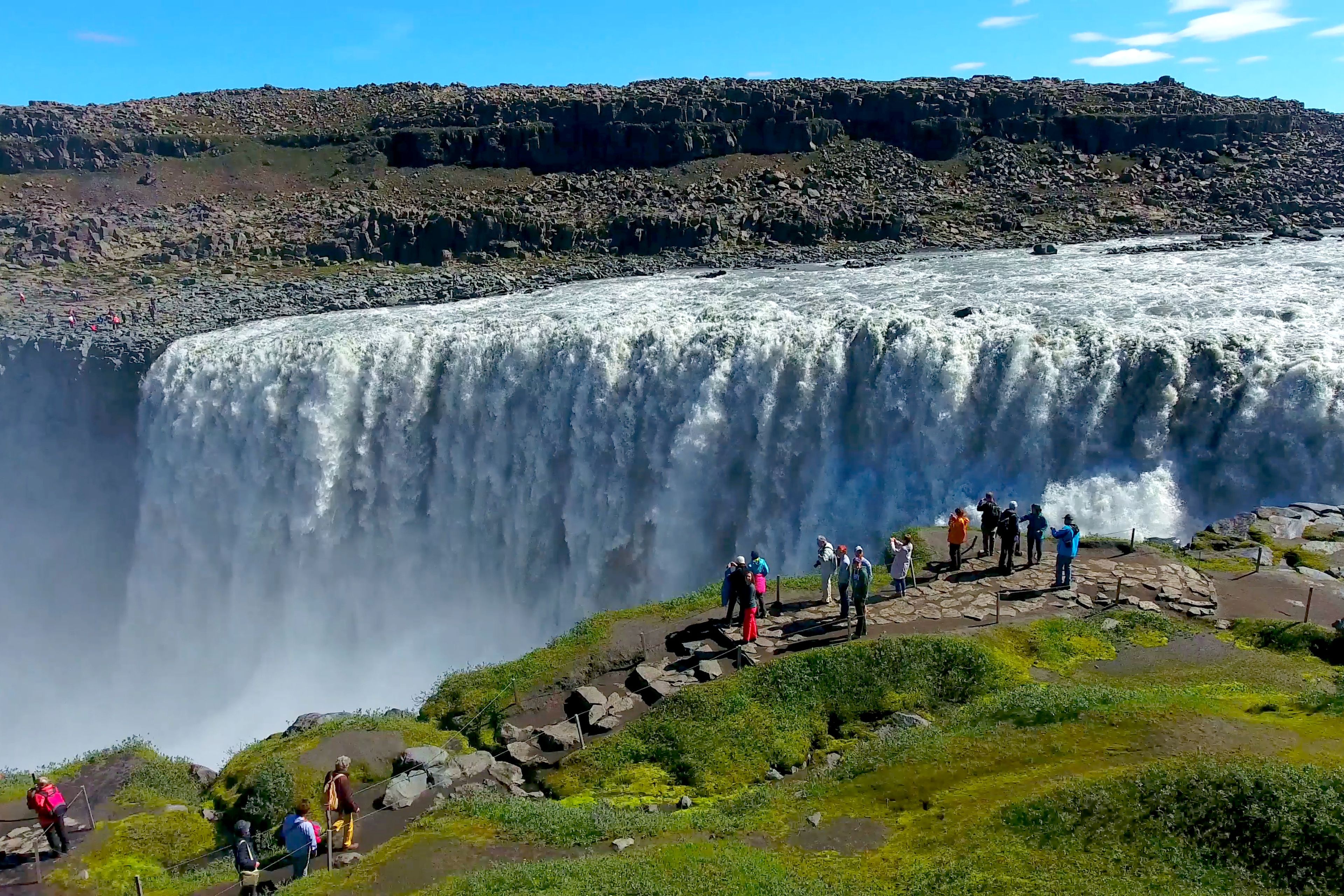 Several people came to see the magnificent Dettifoss waterfall