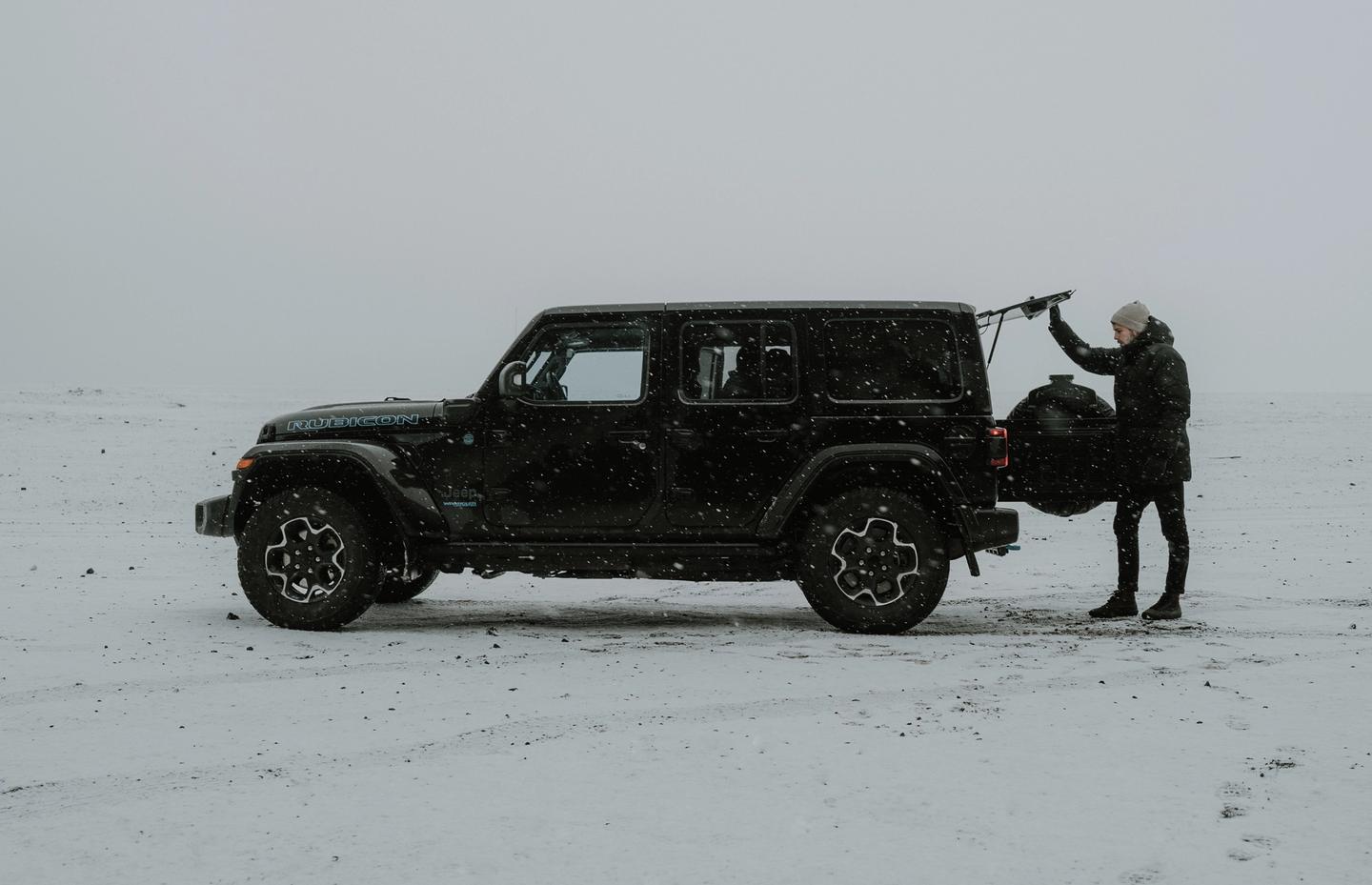 view on a black Iceland jeep rental parked in the snow in Iceland.