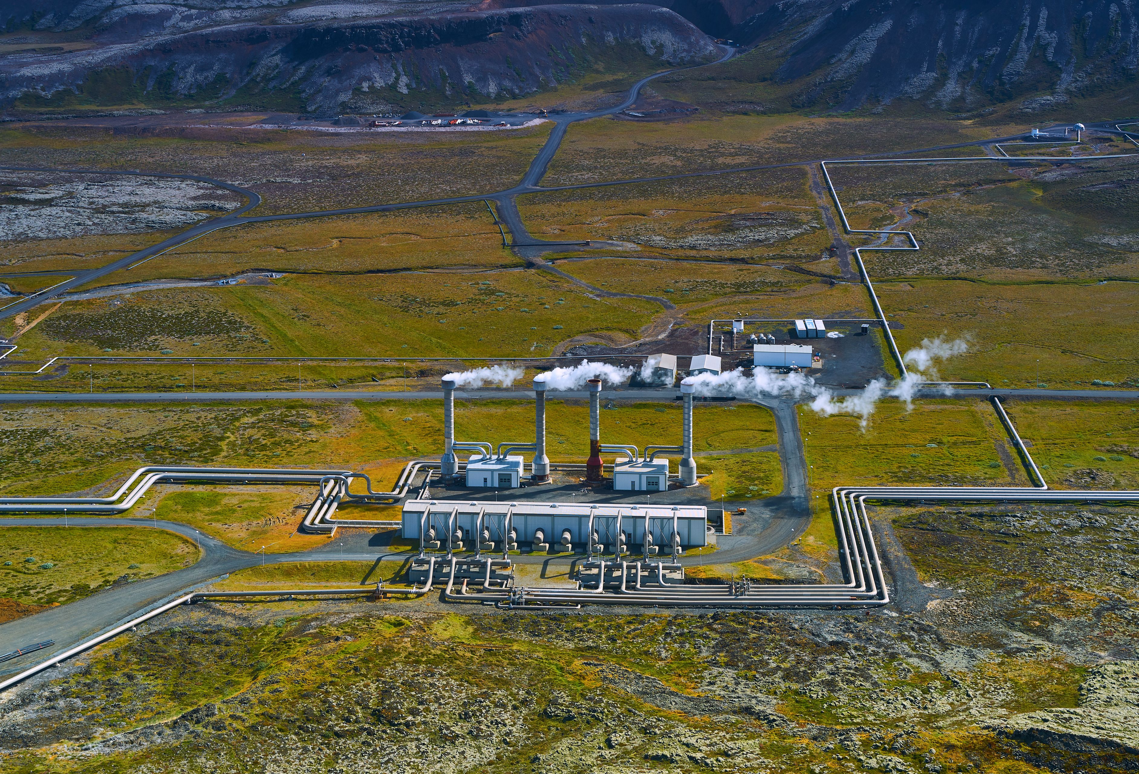 Aerial view of a geothermal power station in the rugged terrain of Iceland