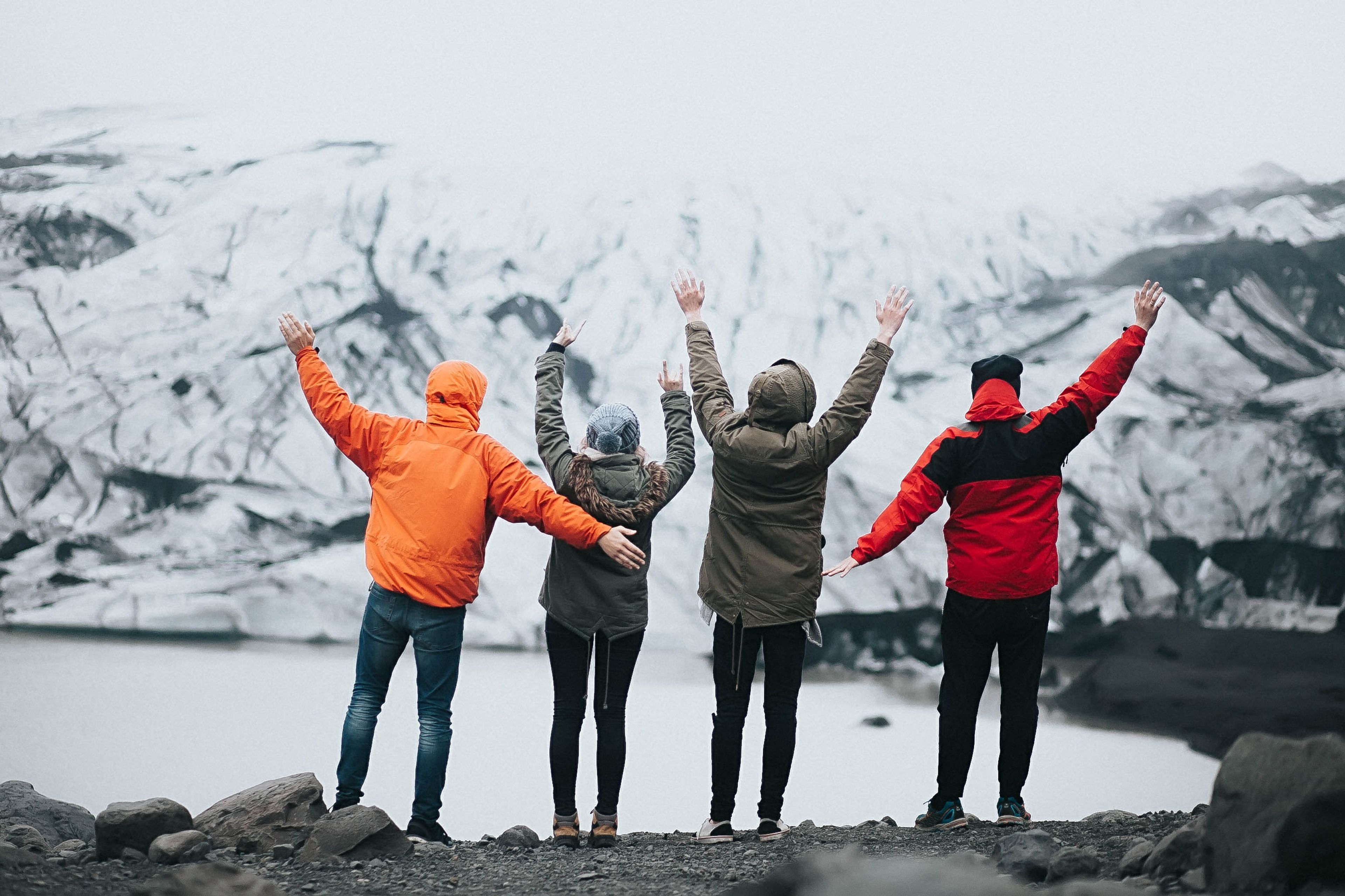 Four friends being happy tighter in iceland